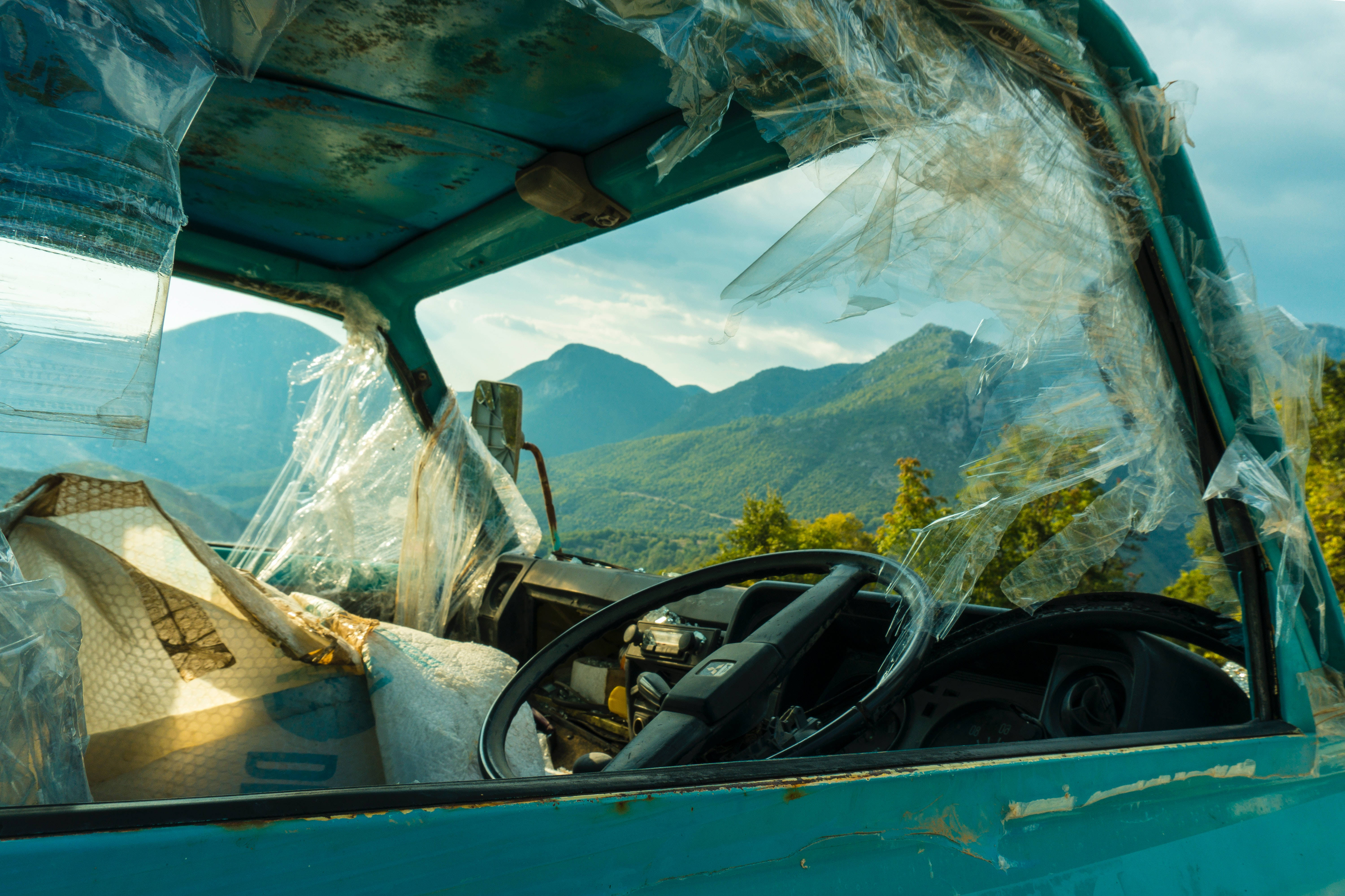 rusted teal truck, shattered plastic windows, scenic mountain valley, 5K Desktop Wallpaper