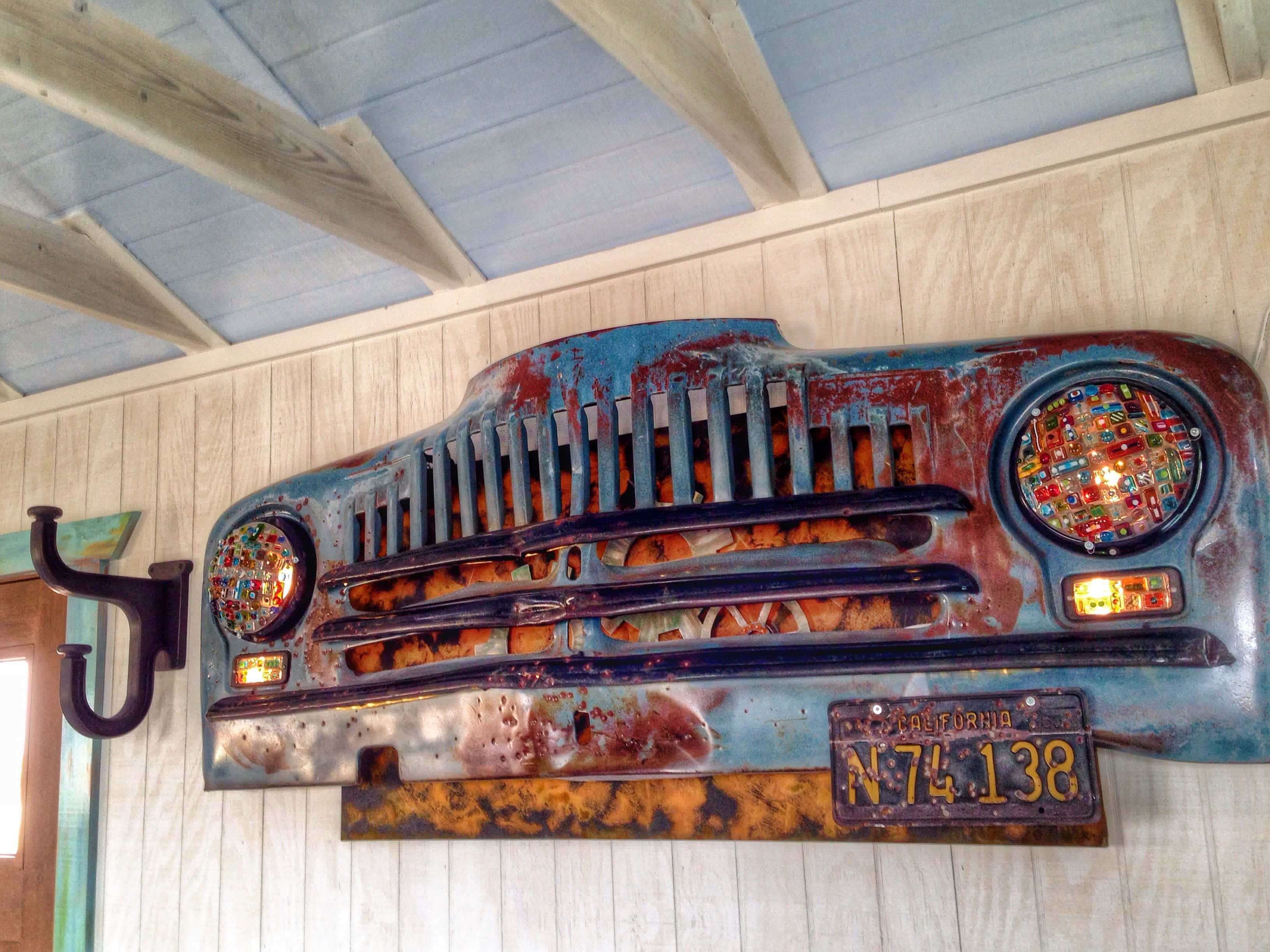 vintage car grille, mosaic headlights, wood-paneled wall, 2K Desktop Wallpaper