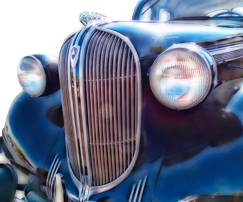 vintage blue car, gleaming chrome grille, round headlights, SD Desktop Wallpaper