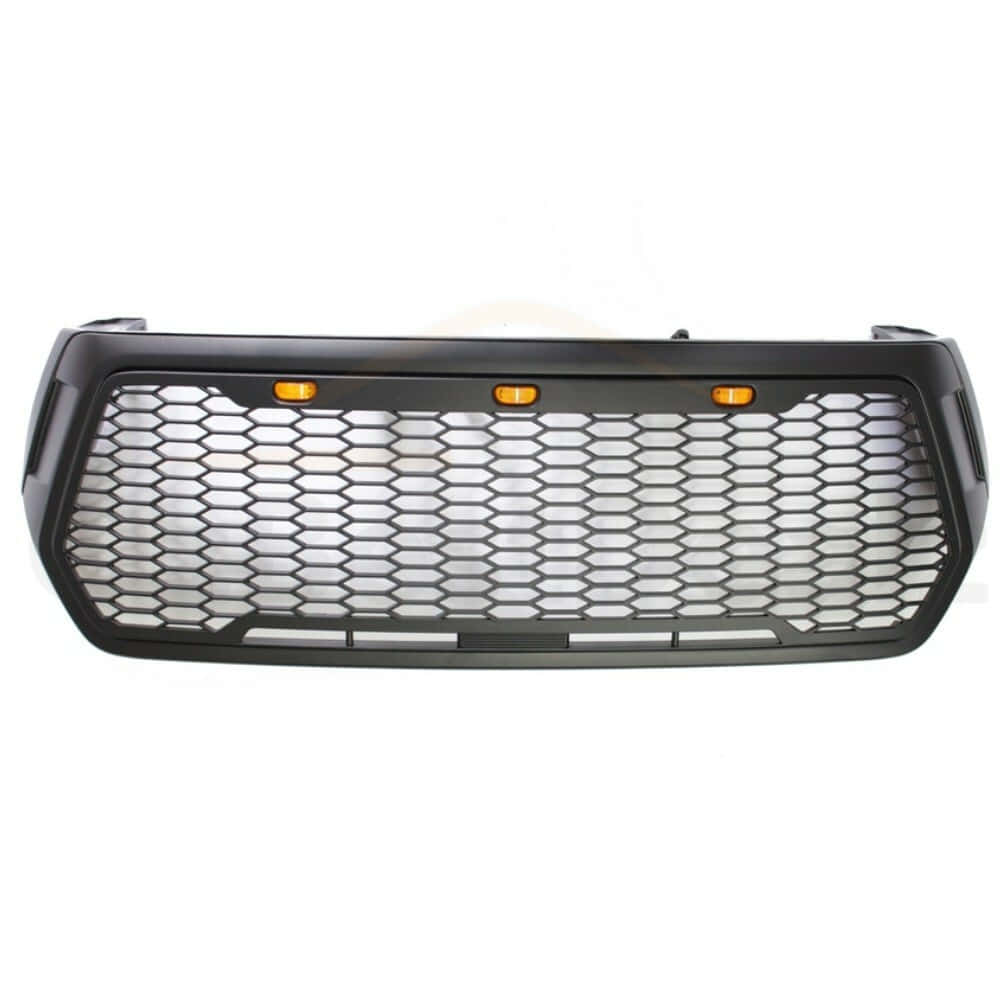 black hexagonal mesh truck grille, three orange turn signals, white background, SD Desktop Wallpaper