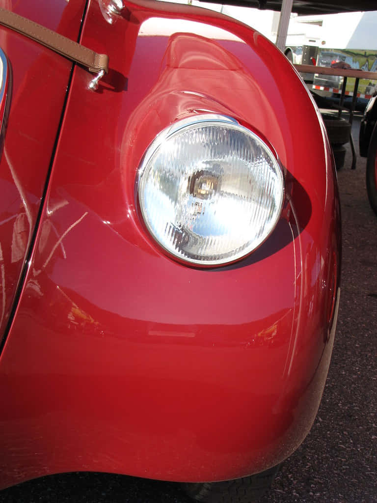 vintage red car, rounded headlight, glossy curved fender, SD Phone Wallpaper