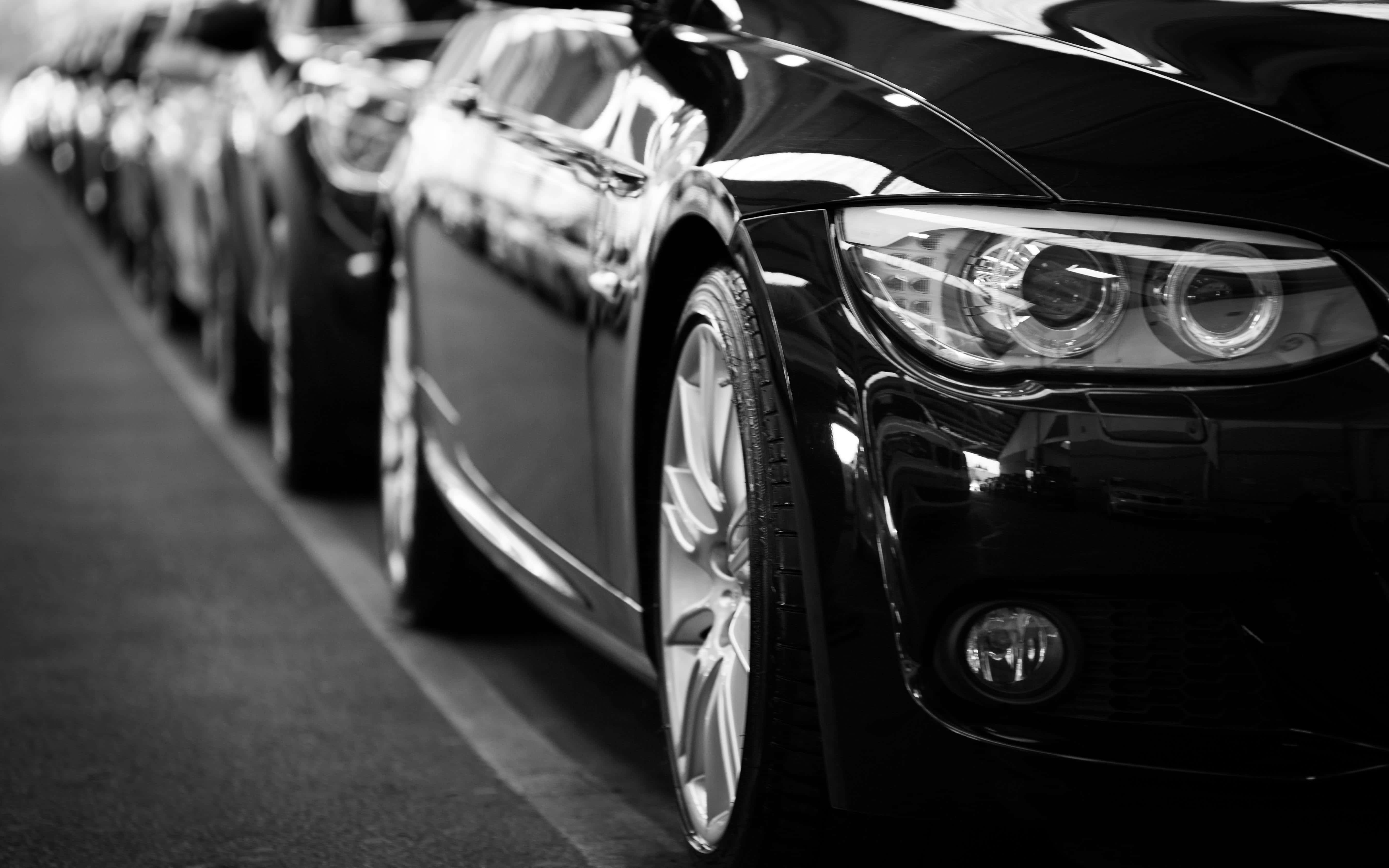 sleek black luxury cars, bright lights, monochrome display, 5K Desktop Wallpaper