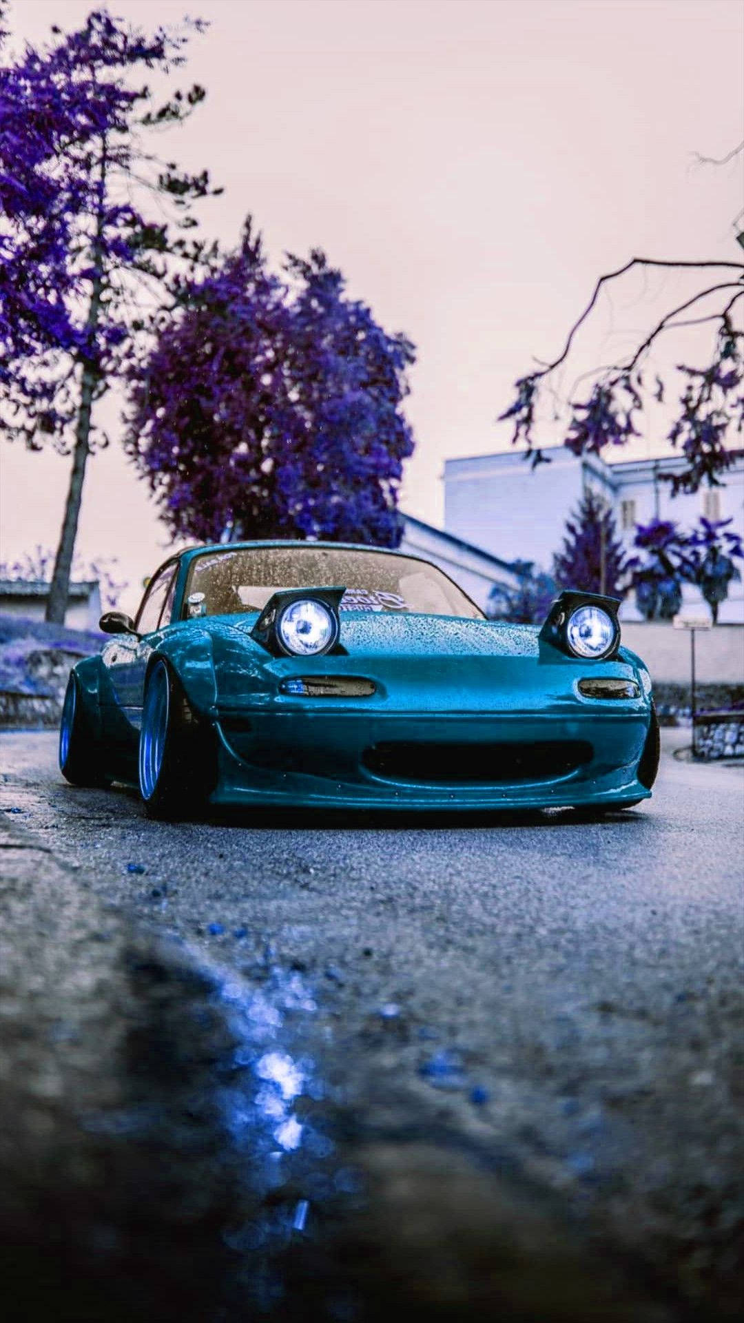 teal sports car, glowing headlights, wet pavement, Full HD Phone Wallpaper