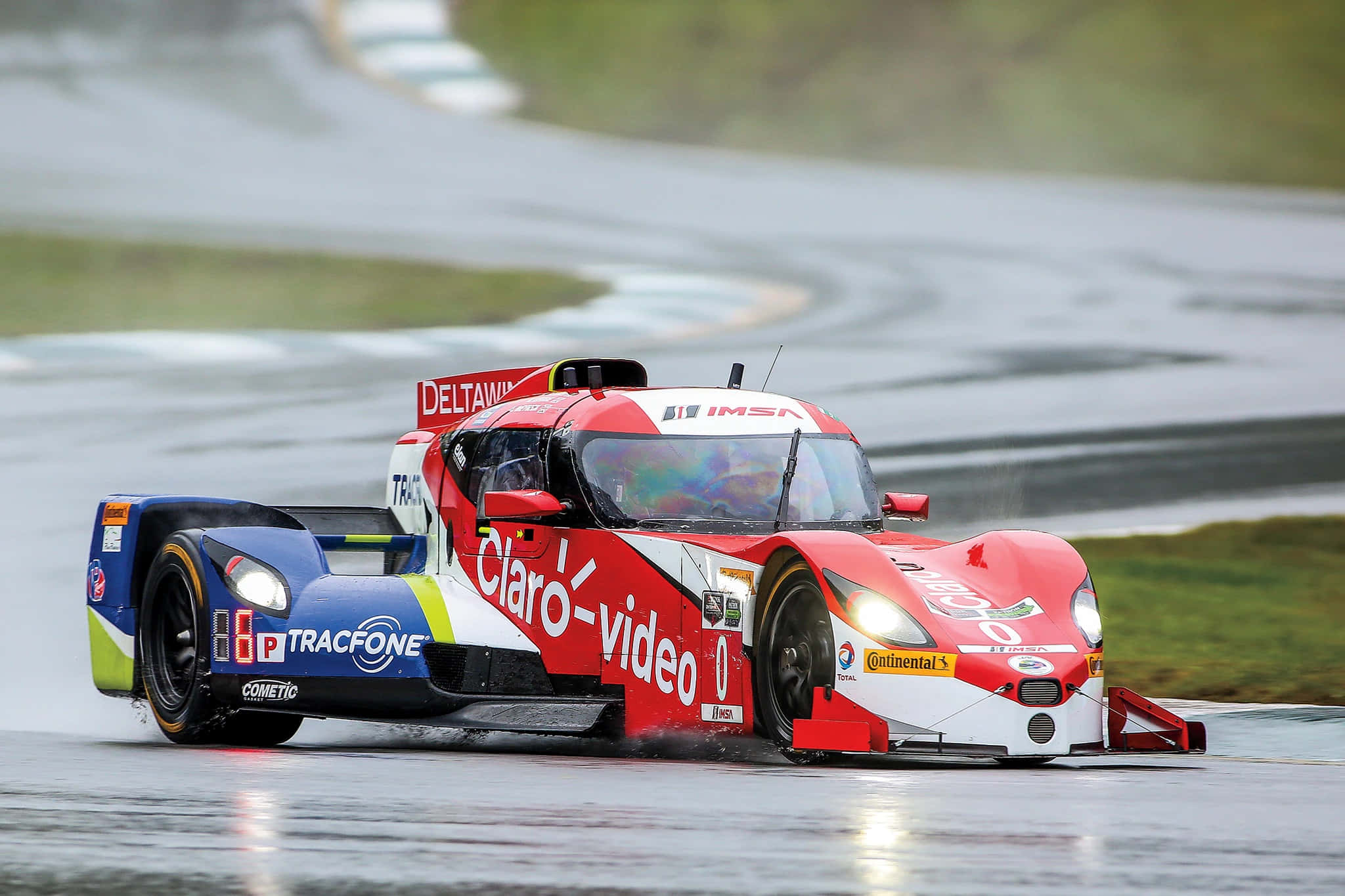 red white and blue race car, wet turn, rain soaked racetrack, Full HD Desktop Wallpaper