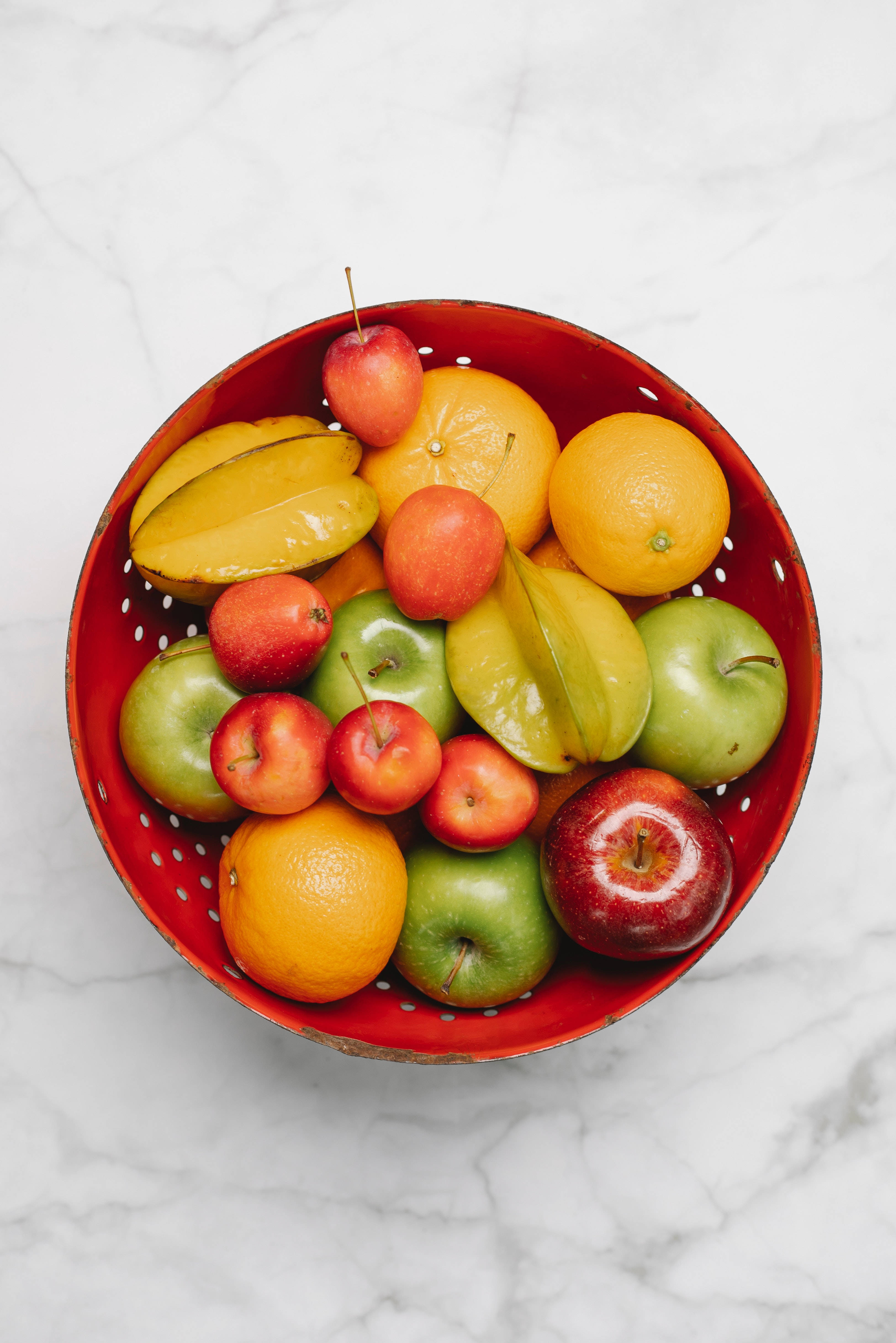 Carambola, red colander, assorted fresh fruits, 4K Phone Wallpaper