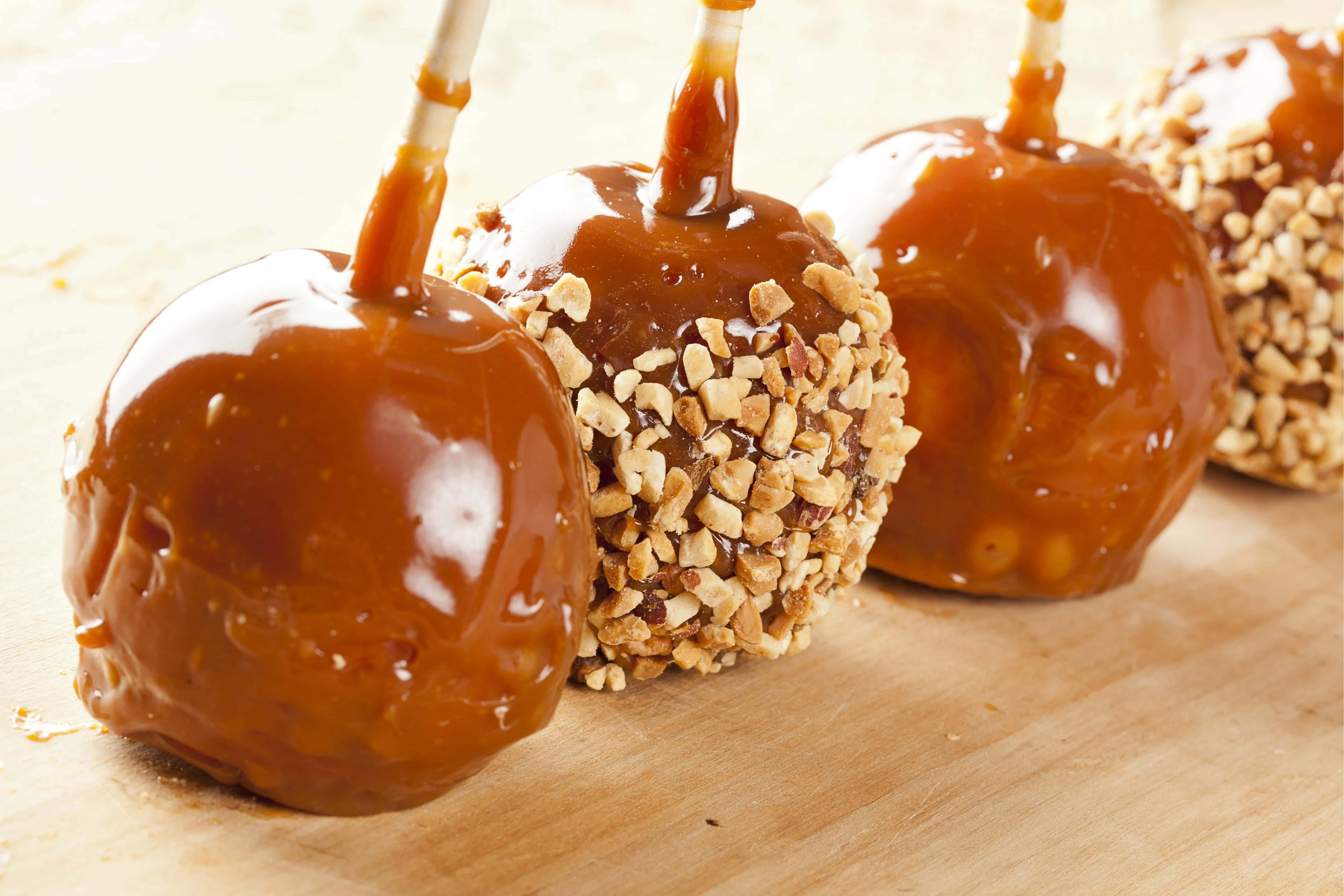 caramel apples, chopped nuts, wooden surface, 4K Desktop Wallpaper