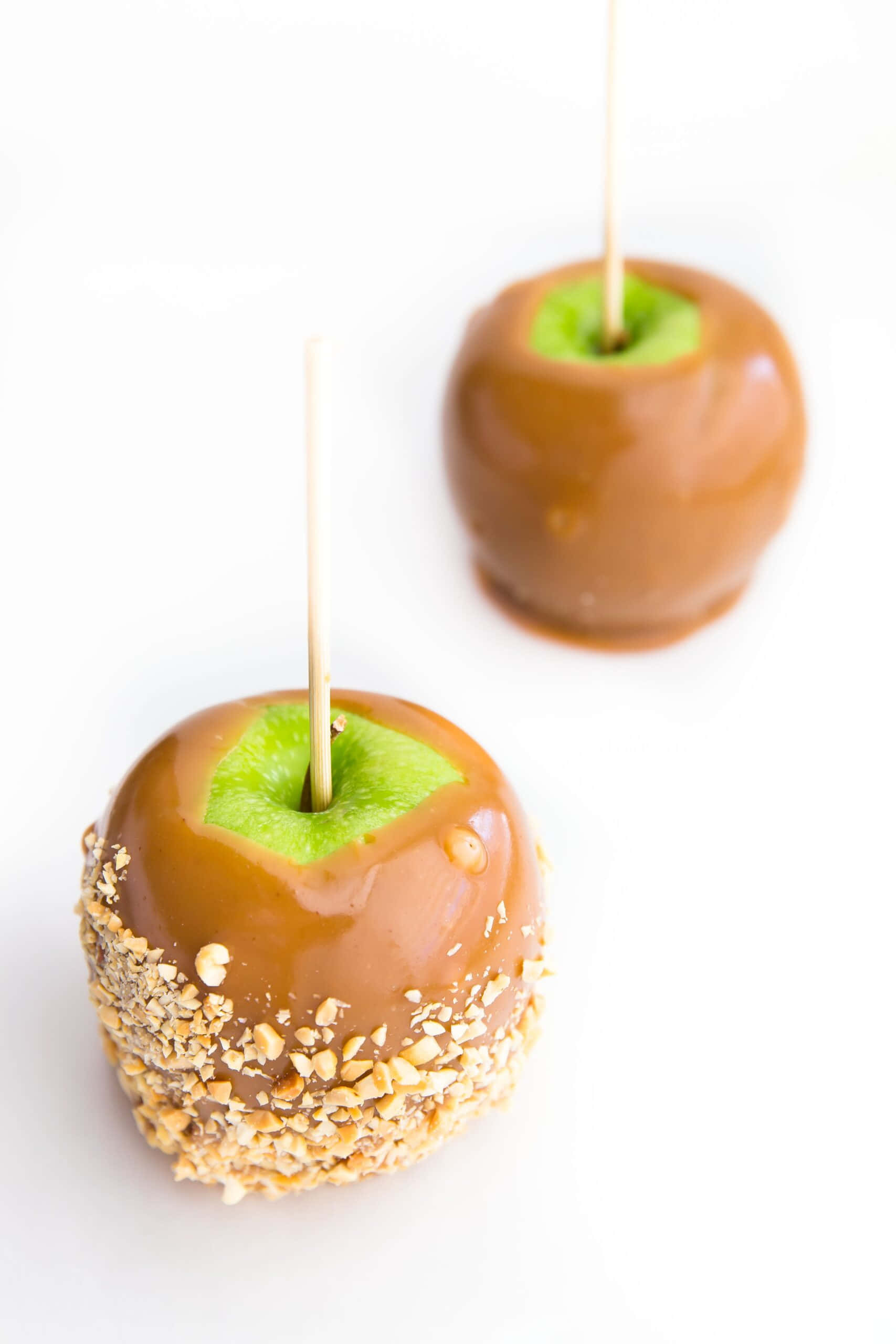 caramel apples, green stems, nut-crumb coating, 2K Phone Wallpaper