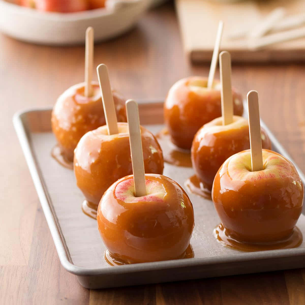 caramel apples, metal tray, warm wooden surface, SD Desktop Wallpaper