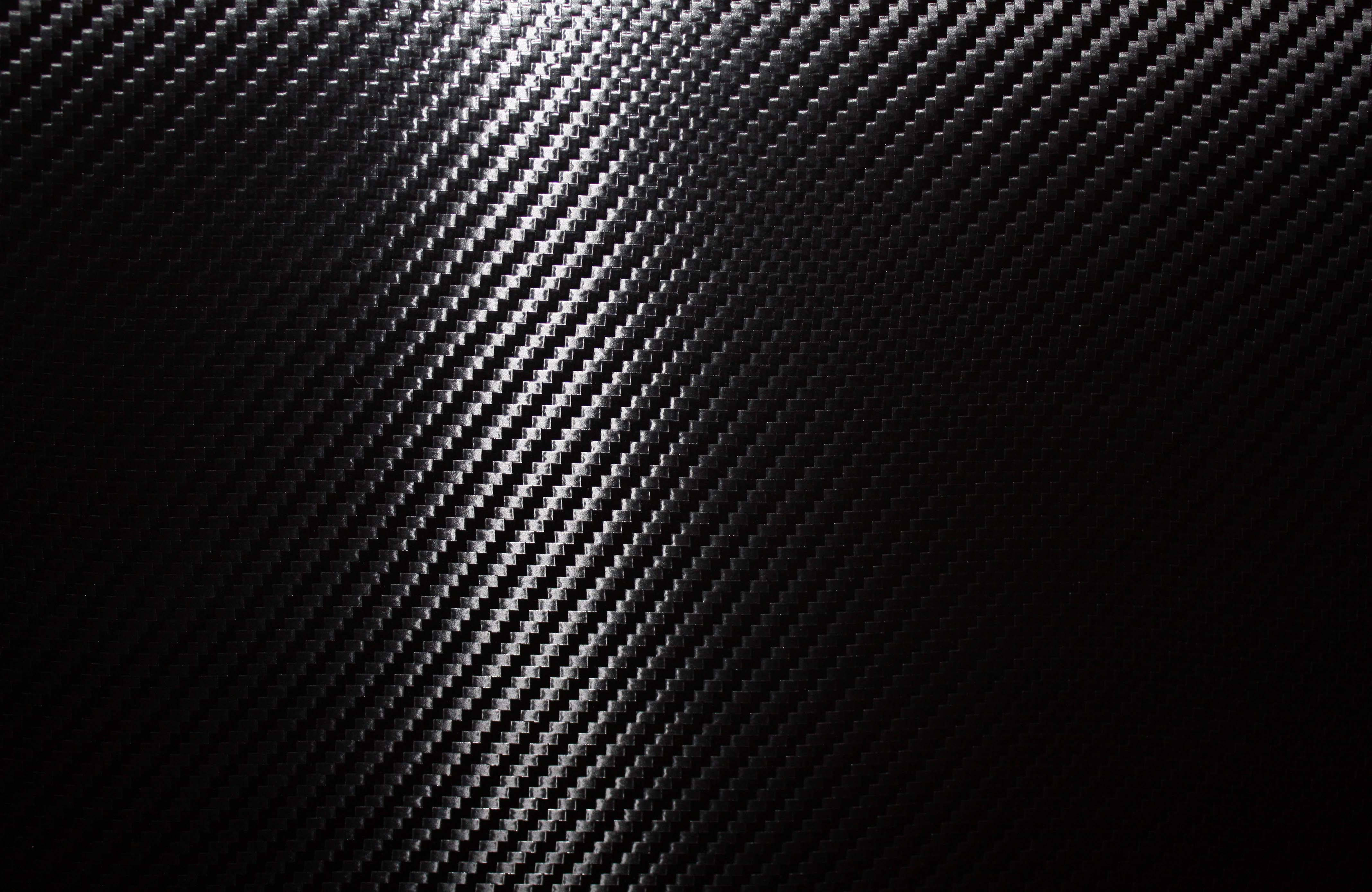 dark carbon fiber, glossy highlights, deep shadow, 4K Desktop Wallpaper