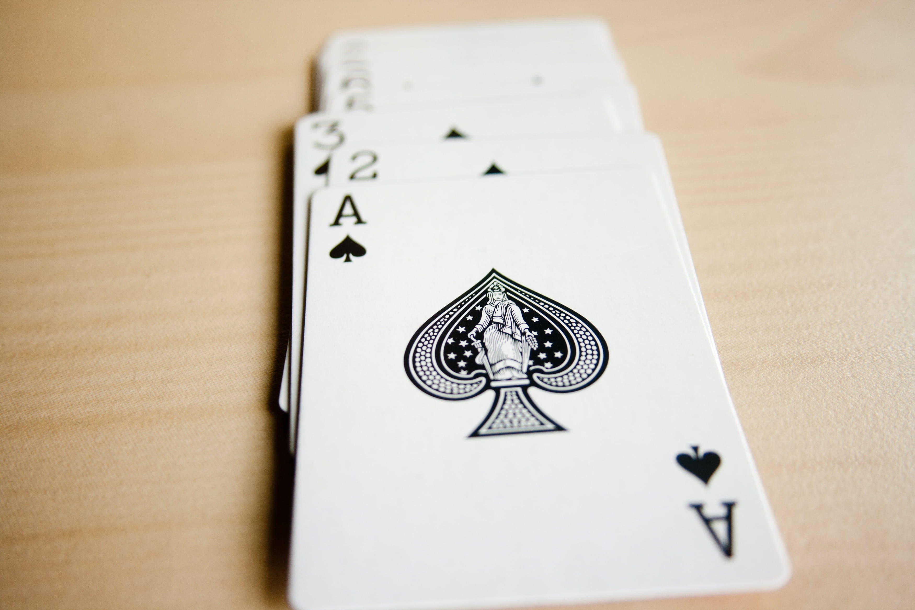 playing cards, ace two and three of spades, light wooden surface, 2K Desktop Wallpaper