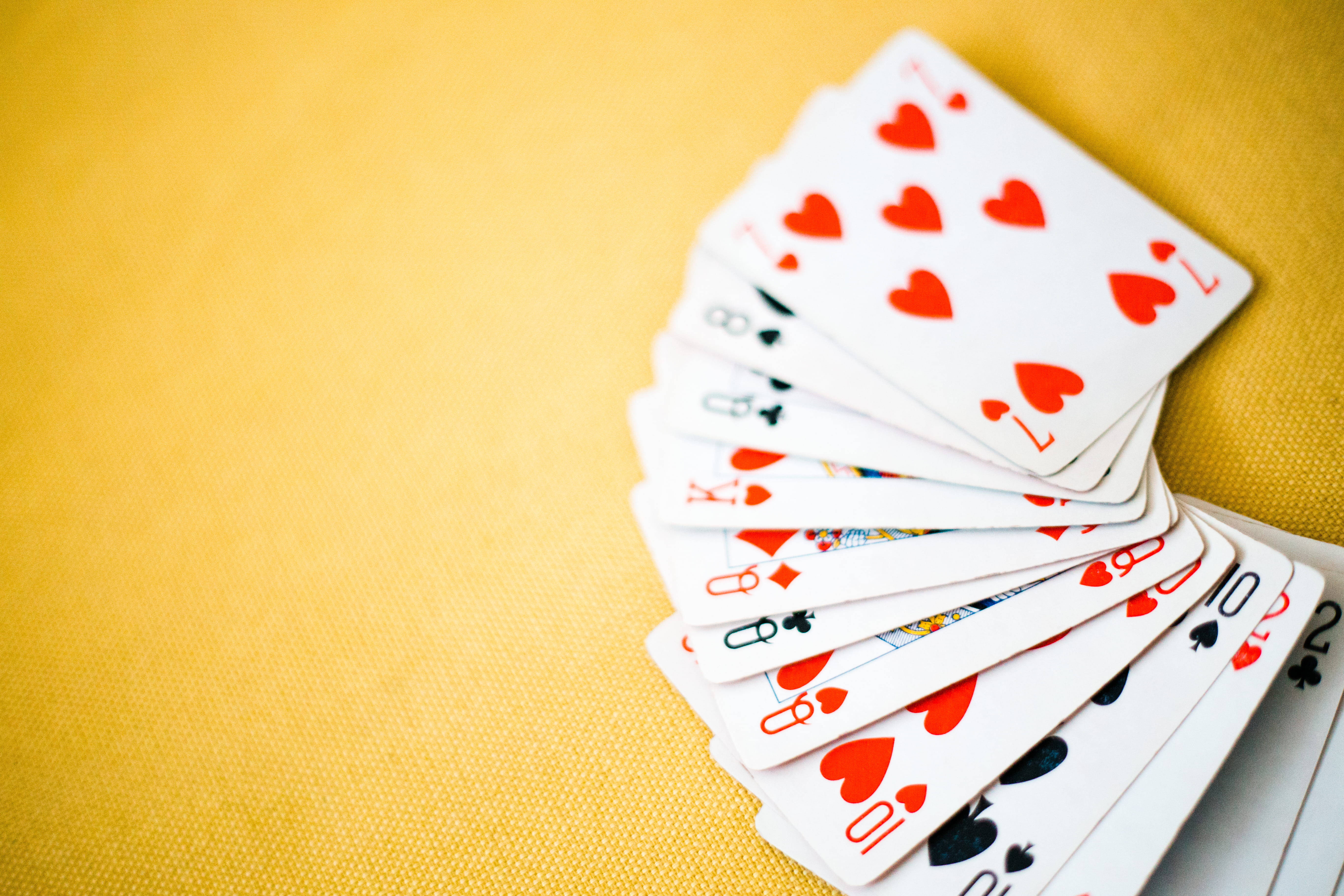 yellow playing cards, red hearts, black suits, 5K Desktop Wallpaper