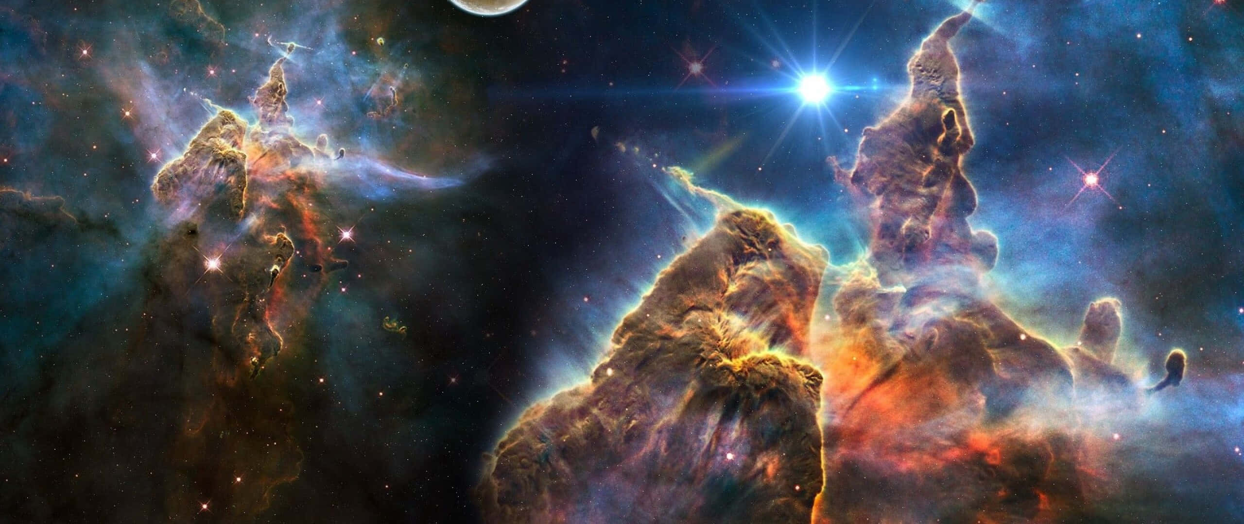 Carina Nebula, gigantic cosmic pillars of gas and dust, fiery orange, 2K Desktop Wallpaper