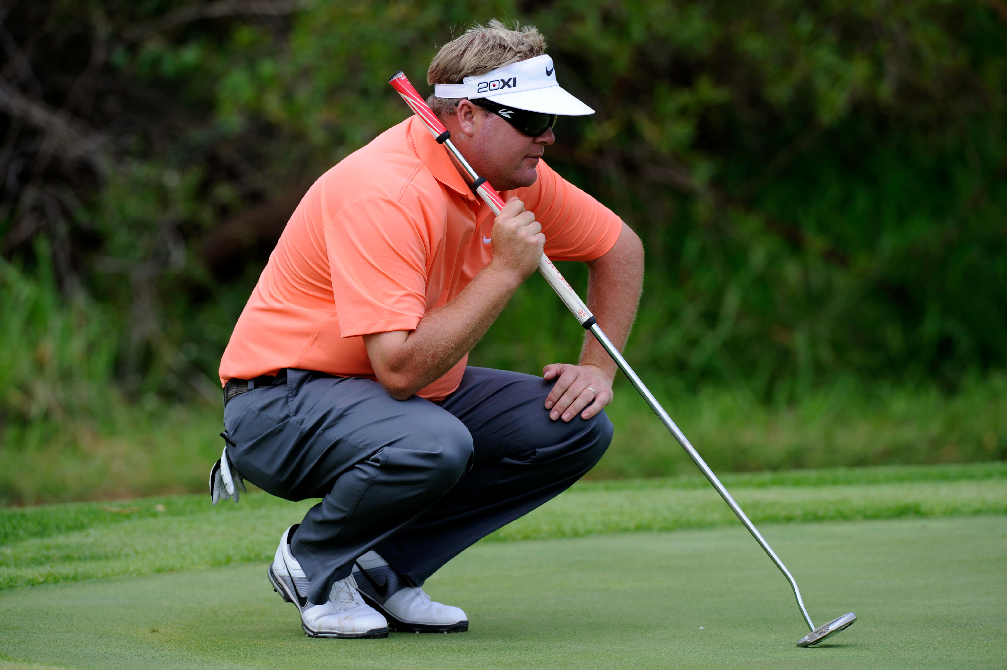 Carl Pettersson, orange shirt, green grass course, 4K Desktop Wallpaper