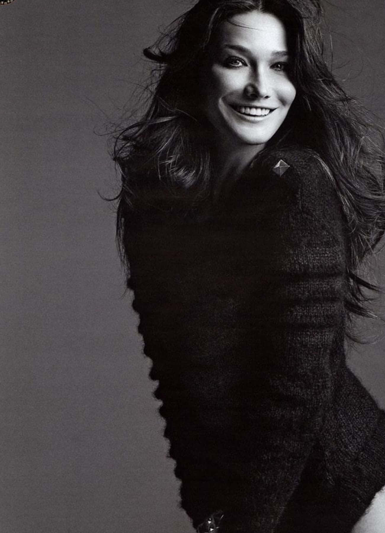 Carla Bruni, textured black sweater, soft gray backdrop, HD Phone Wallpaper