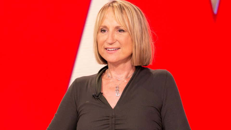 Carol Mcgiffin, blonde bob hair, bold red and white geometric background, SD Desktop Wallpaper