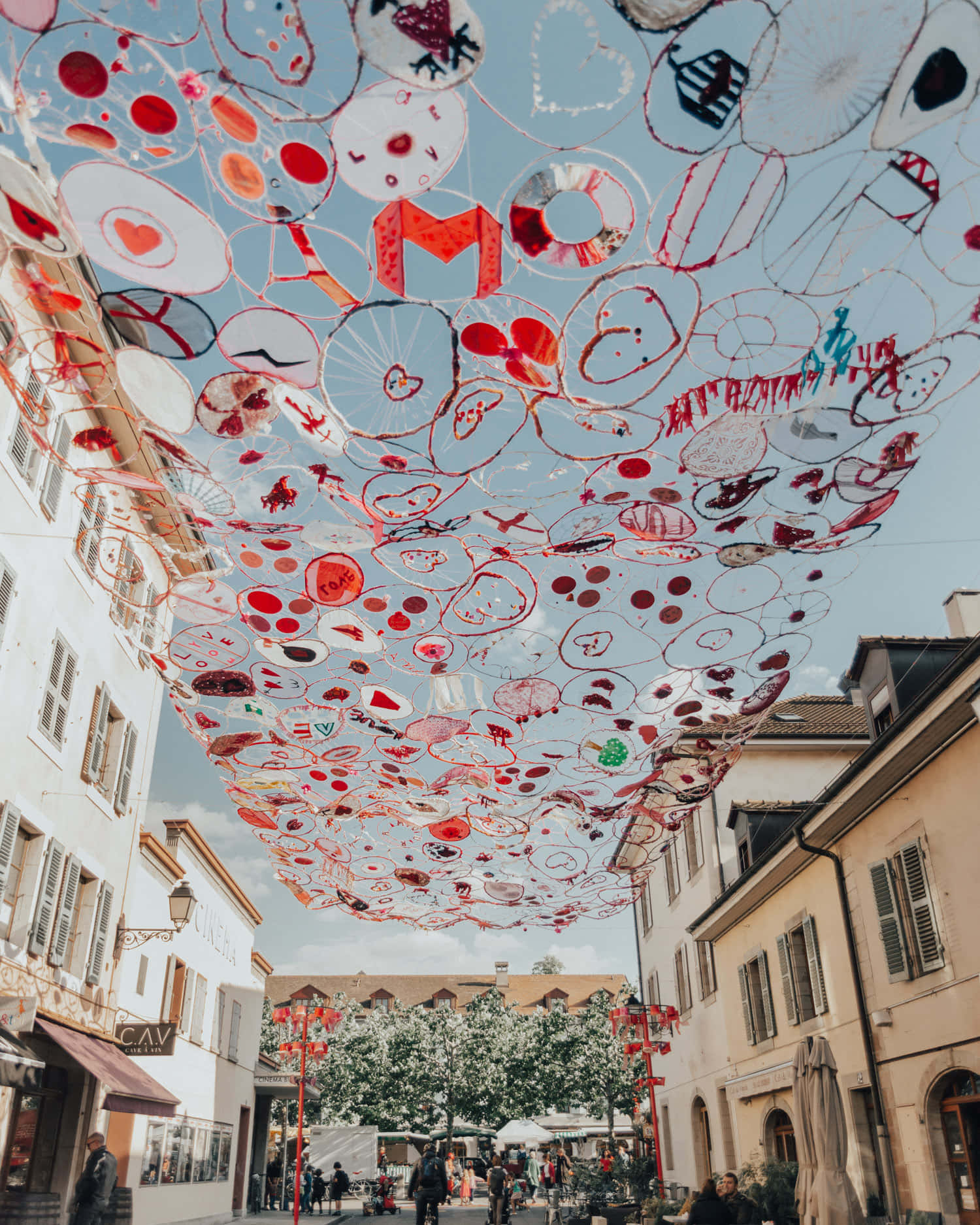 Carouge, red and white circular art installations, sunlit European street, HD Phone Wallpaper