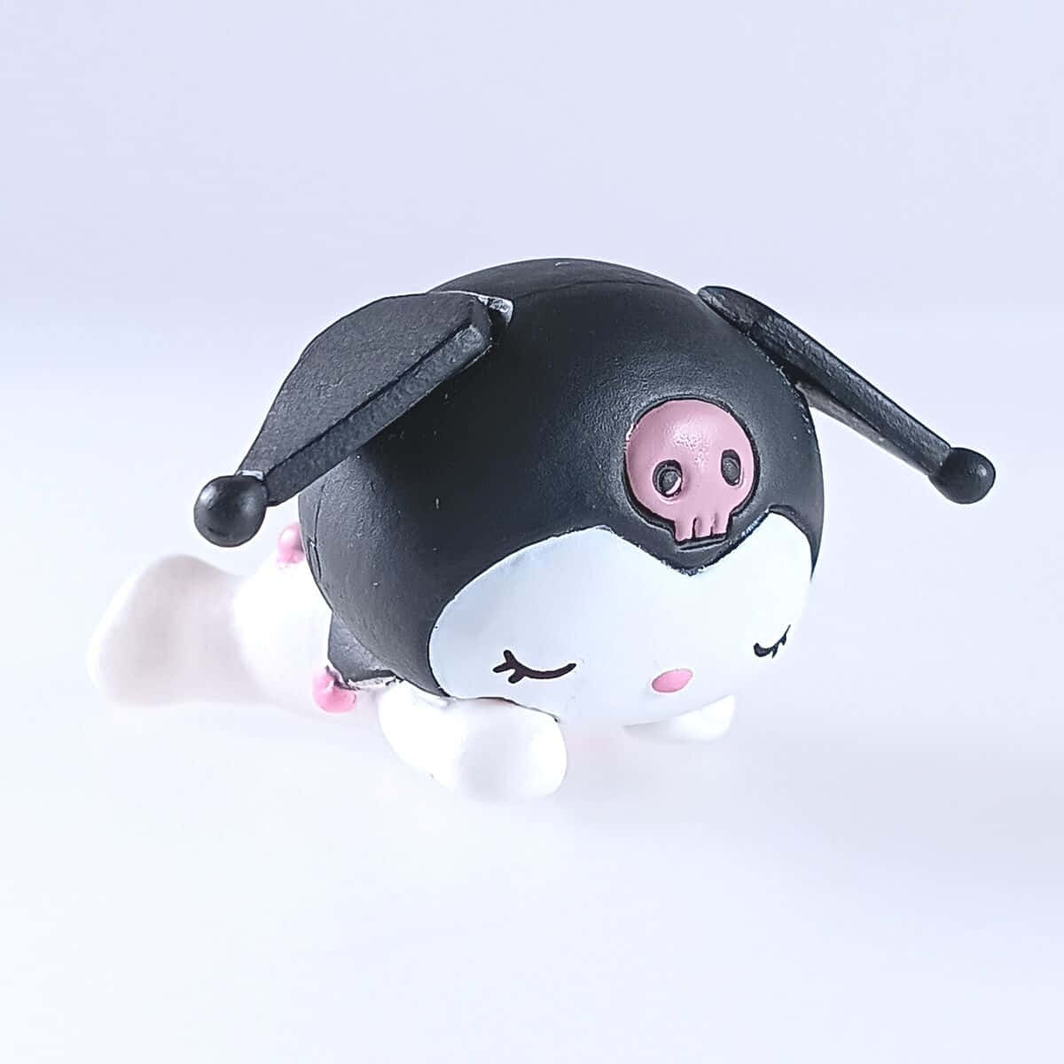 black and white plush toy, pink skull, plain white surface, SD Desktop Wallpaper
