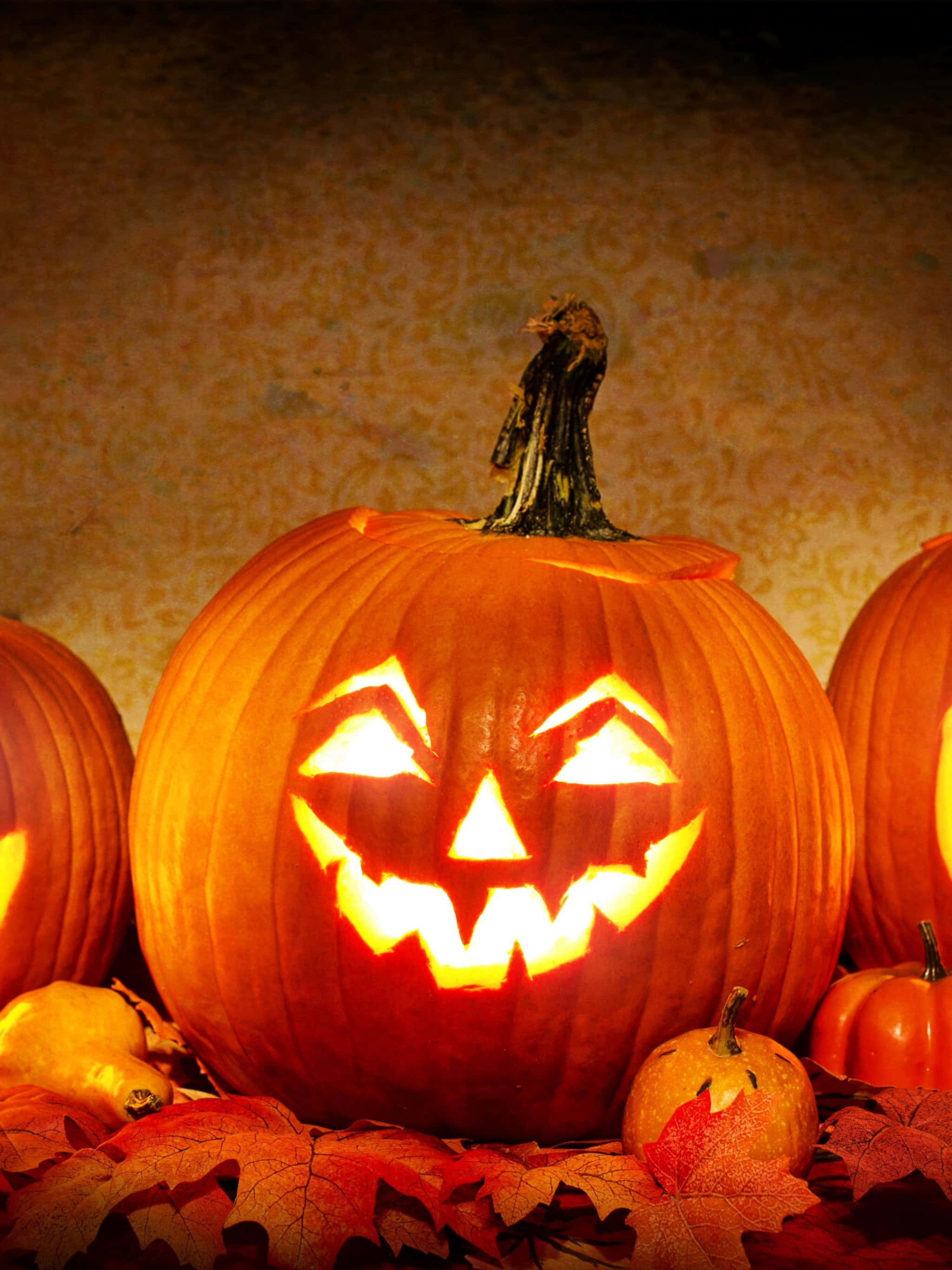 carved pumpkin, wicked grin, autumn leaves, 2K Phone Wallpaper