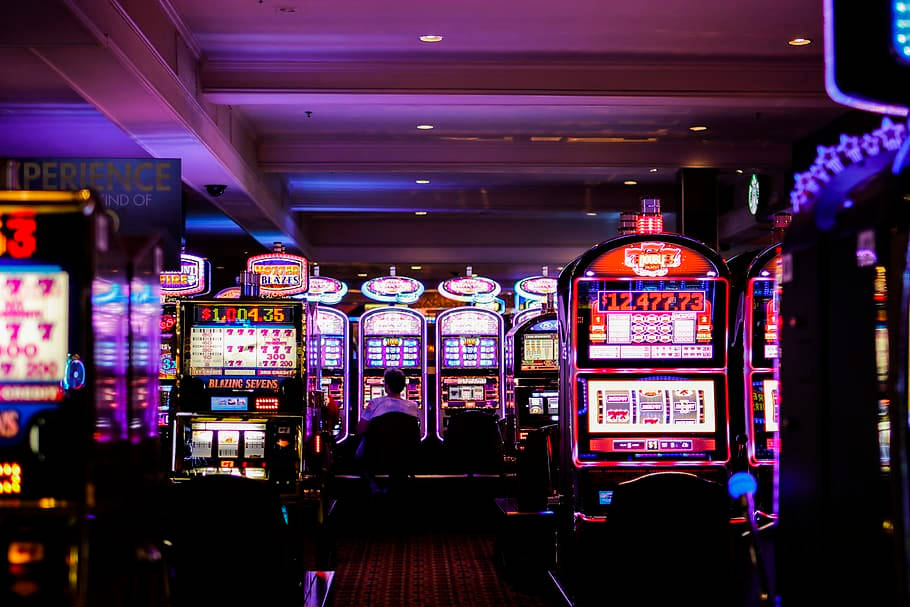 casino, glowing slot machines, vibrant purple and blue light, SD Desktop Wallpaper