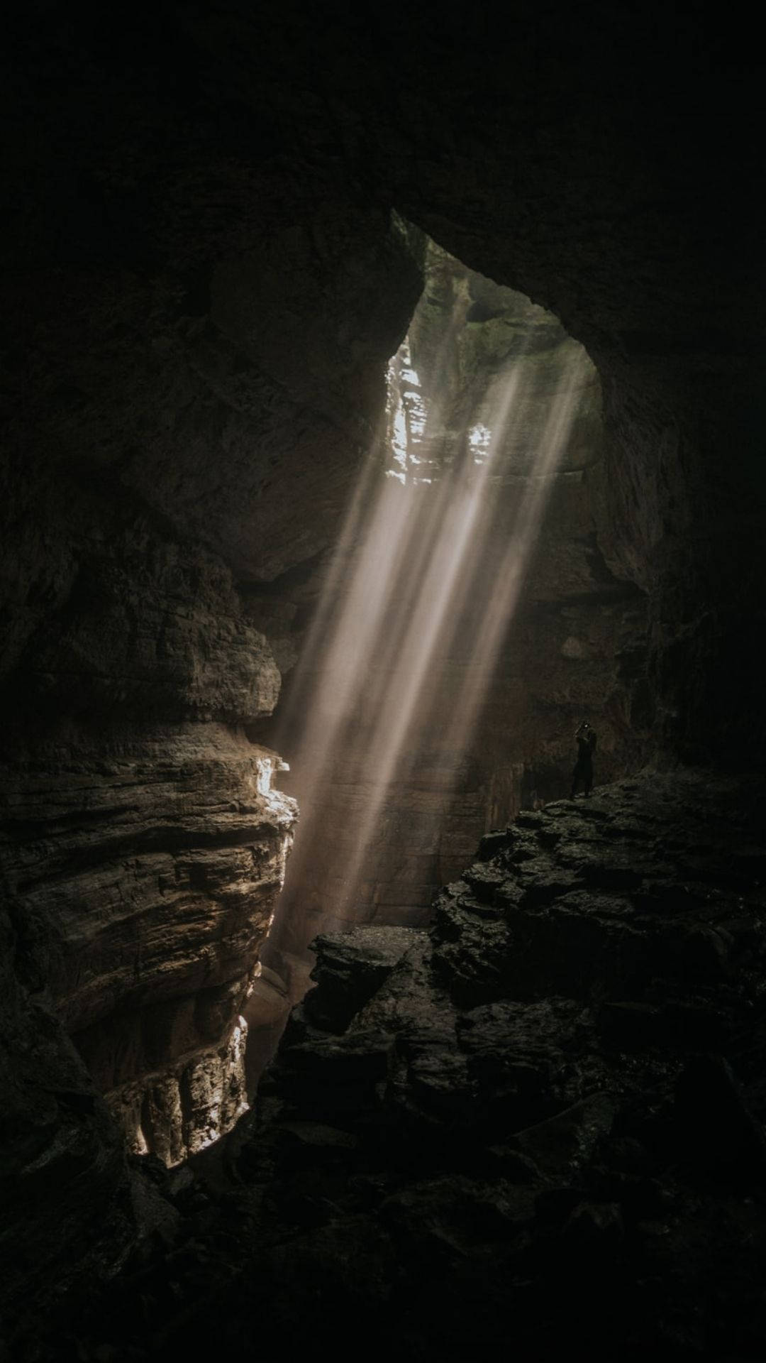 lighted dark cave, divine beams of sunlight, vast dark cave, Full HD Phone Wallpaper