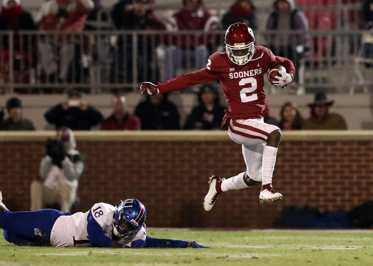 Ceedee Lamb, football ball, crimson Sooners, SD Desktop Wallpaper