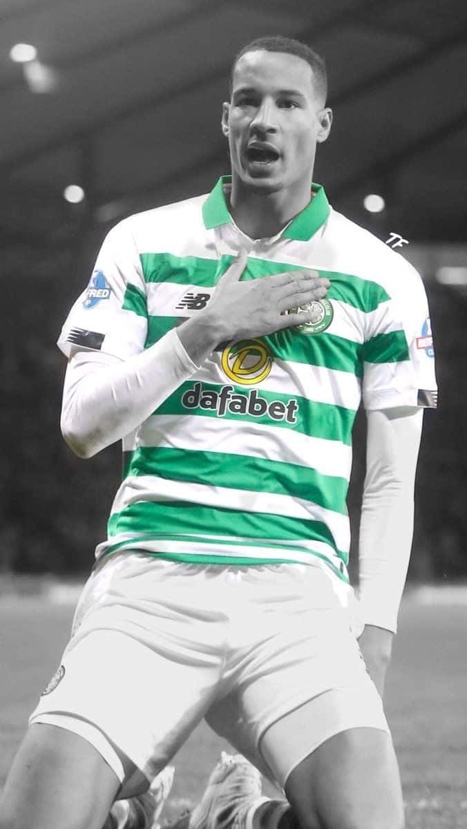 Celtic Fc, green and white striped jersey, kneels on a field, SD Phone Wallpaper