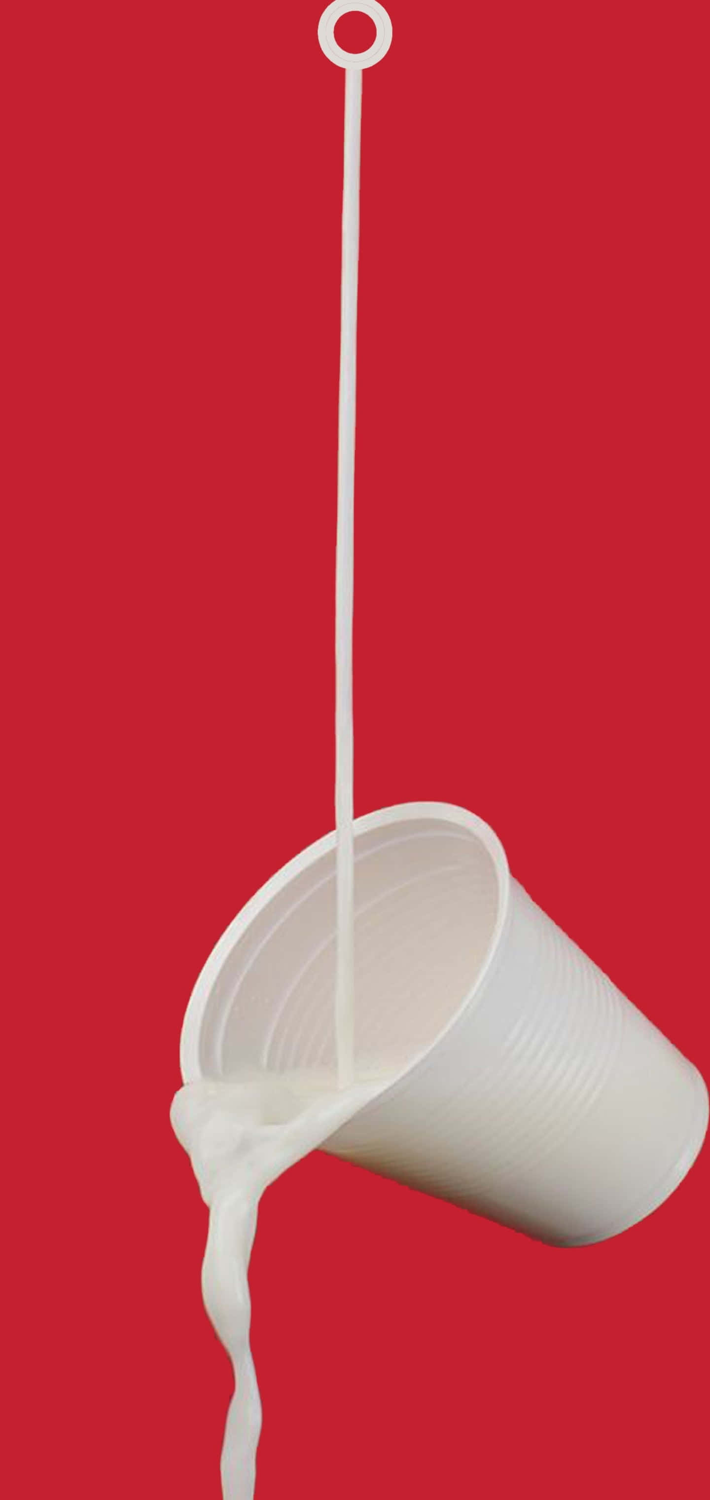 red background, white plastic cup, milk streaming downward, 2K Phone Wallpaper