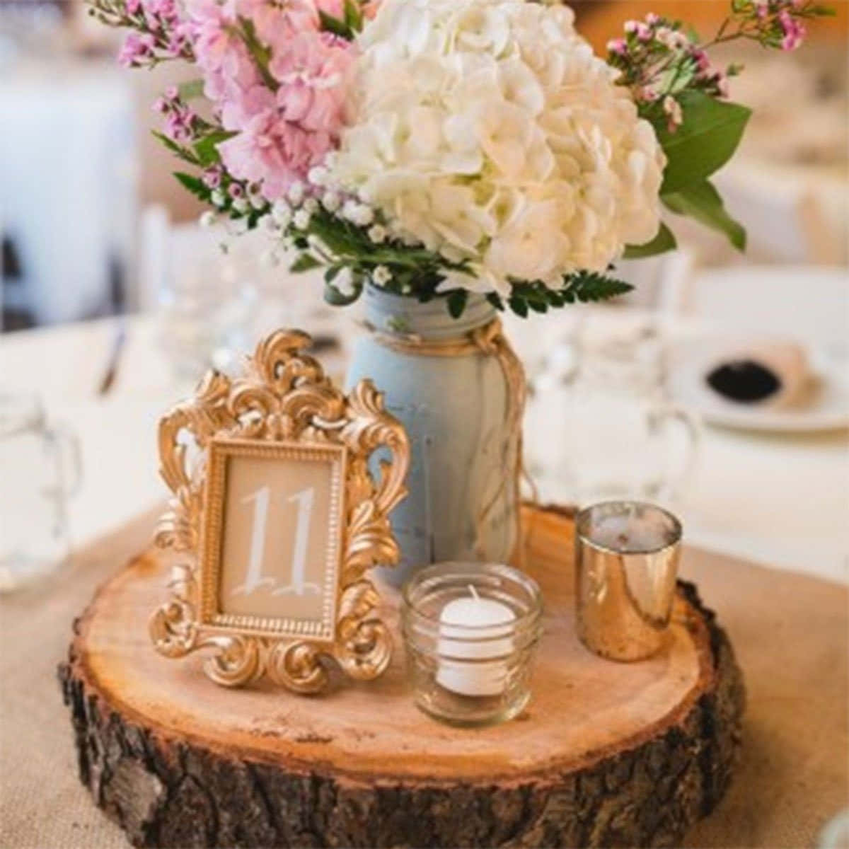 rustic wooden slice centerpiece, pink and white hydrangeas, gold ornate frame with number 11, SD Desktop Wallpaper