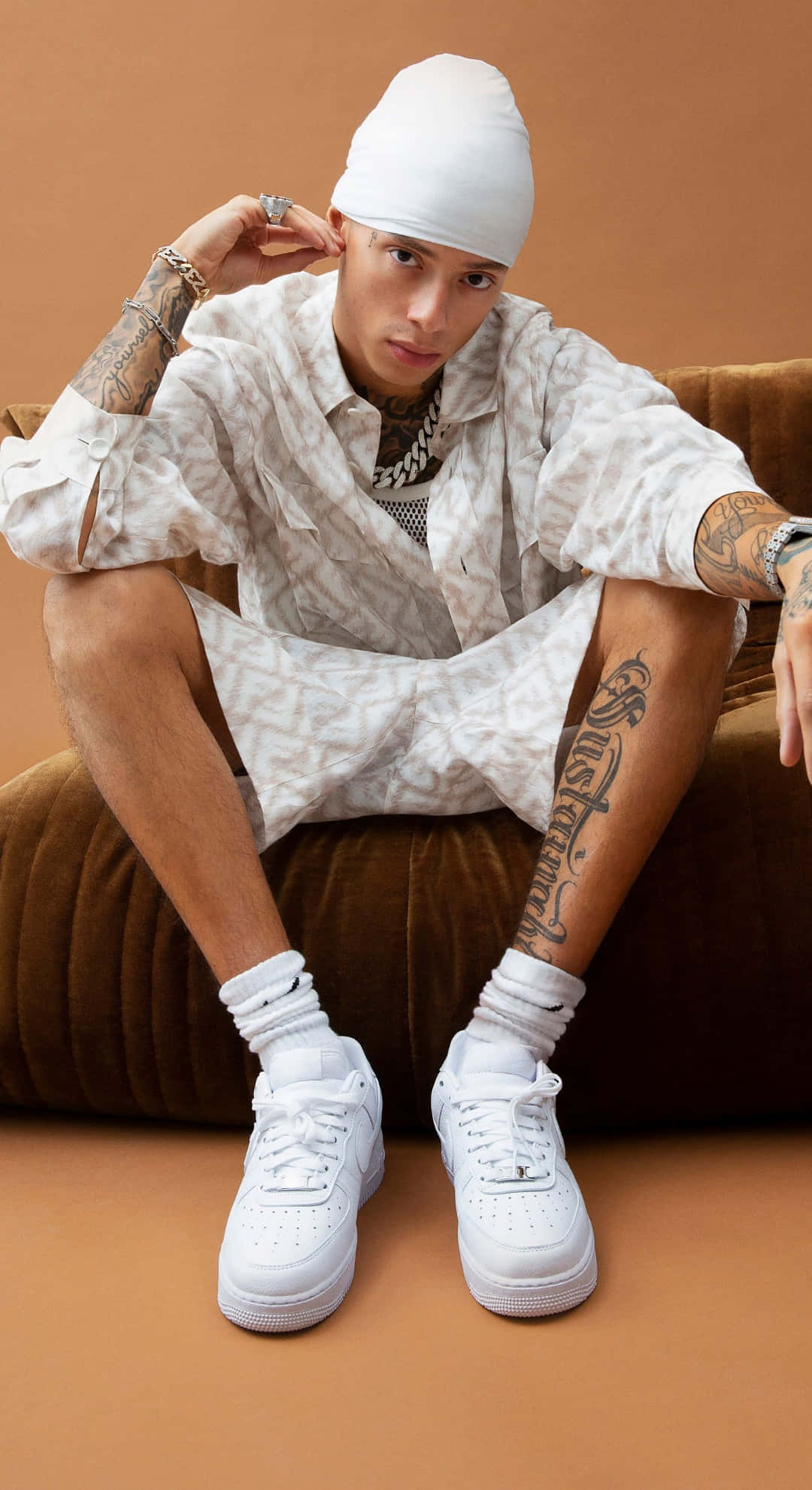 Central Cee, tattoos, brown velvet couch, Full HD Phone Wallpaper
