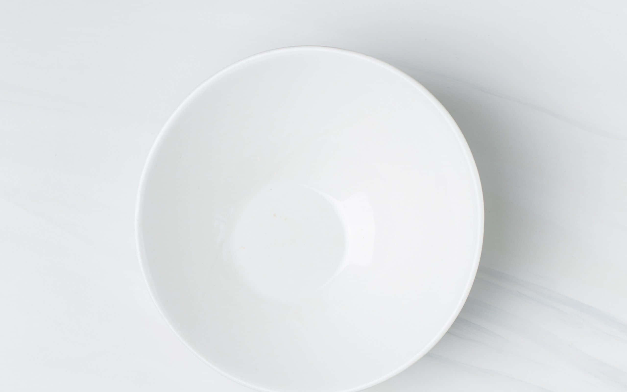 ceramic pot, pristine white ceramic bowl, light gray marble surface, 2K Desktop Wallpaper