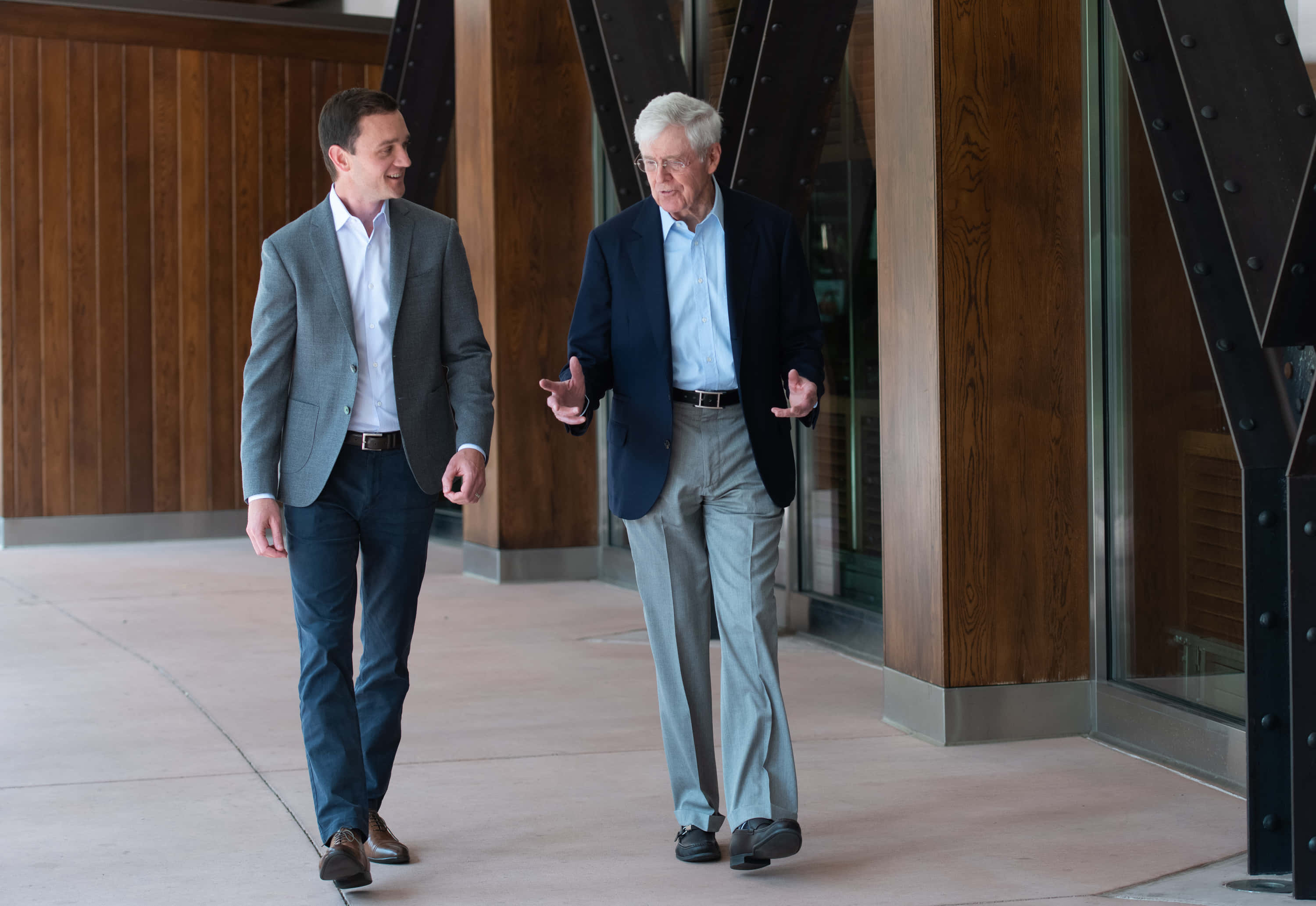 Charles G. Koch, business attire, modern wooden and steel architectural corridor, 2K Desktop Wallpaper