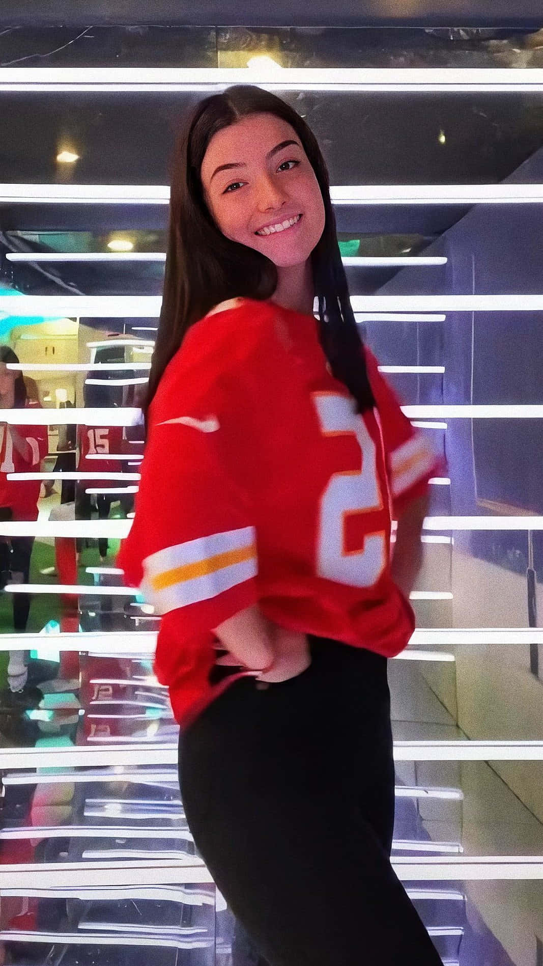 Charlie Damelio, red football jersey, glowing neon-lit striped wall, HD Phone Wallpaper