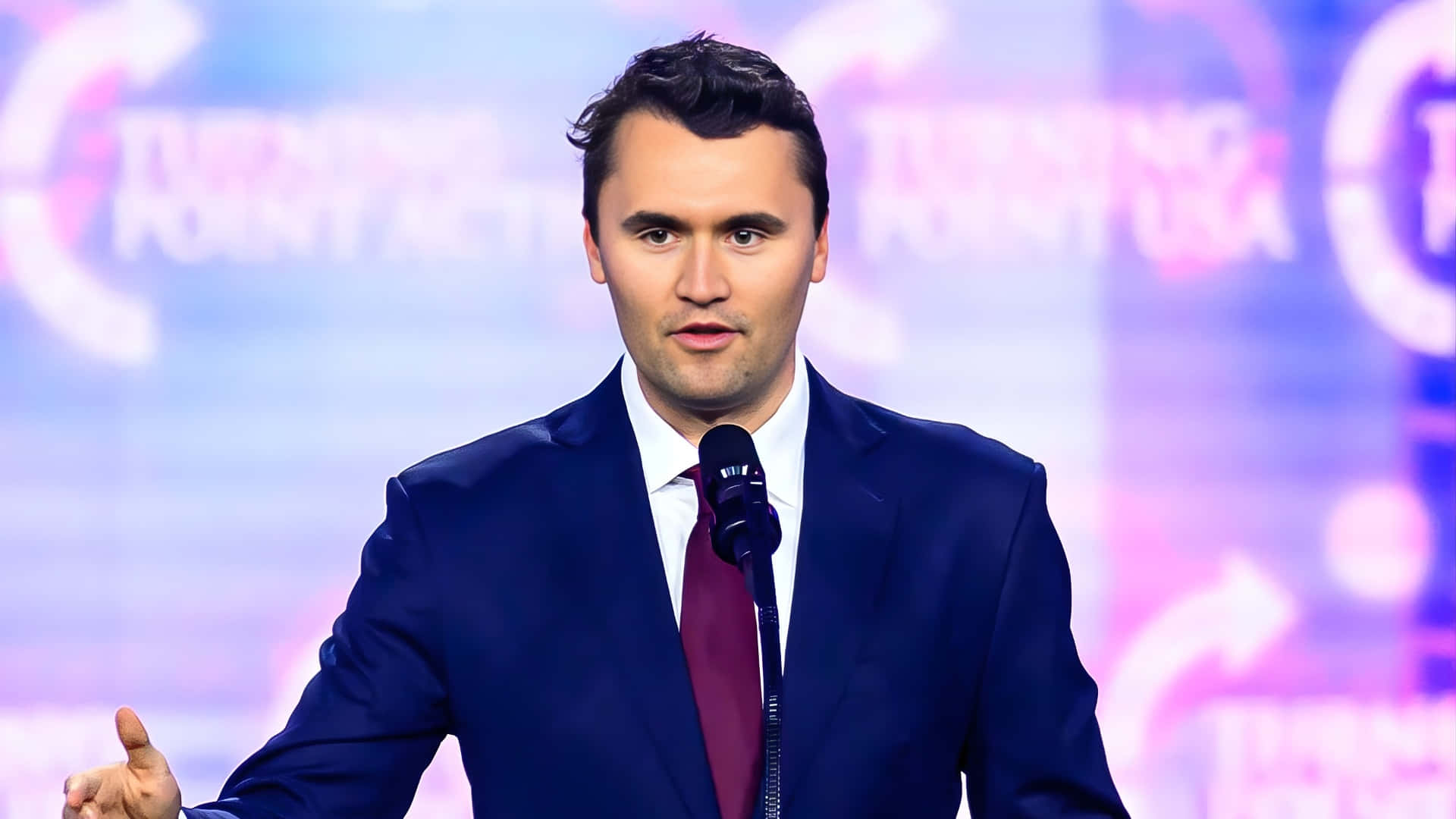 Charlie Kirk, dark blue suit, maroon tie, Full HD Desktop Wallpaper