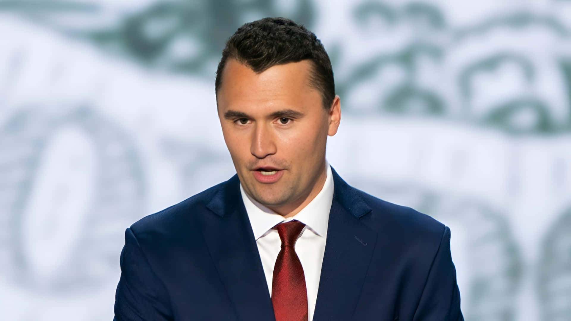 Charlie Kirk, navy suit, red tie, Full HD Desktop Wallpaper