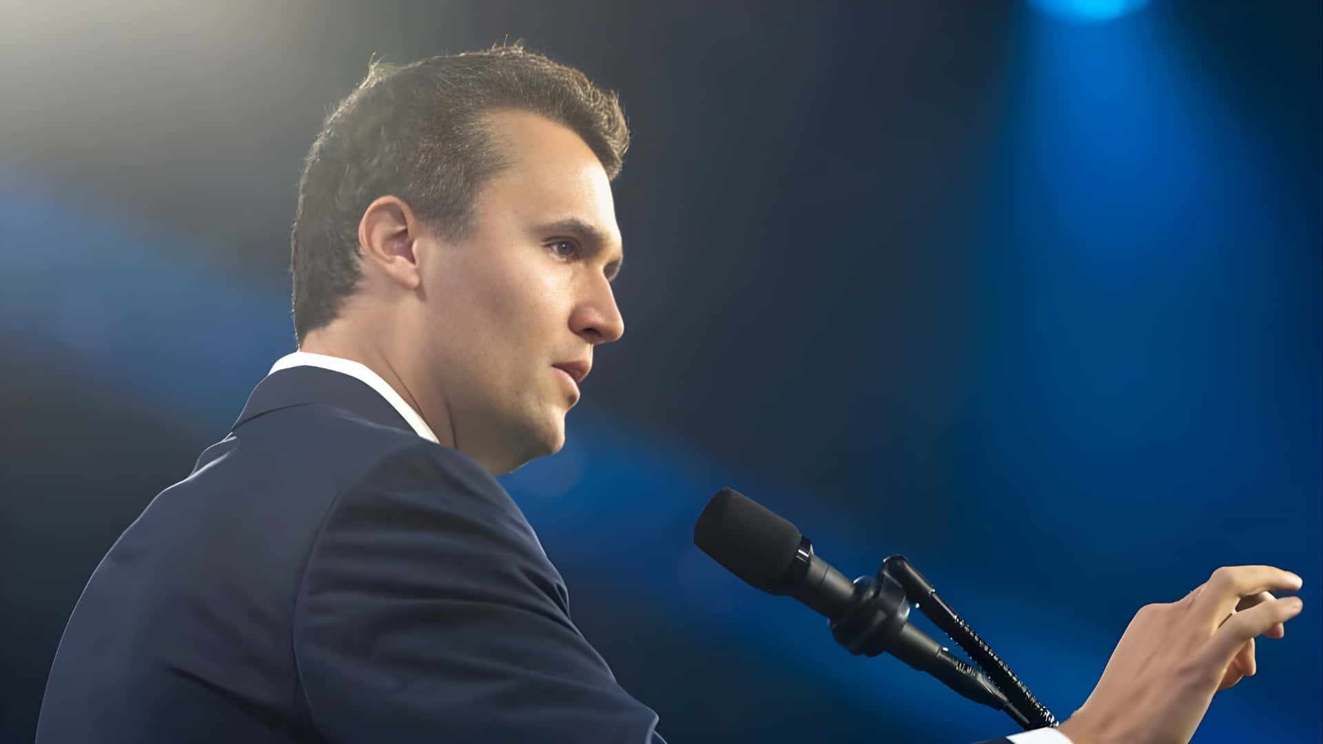 Charlie Kirk, dark suit, microphone, Full HD Desktop Wallpaper
