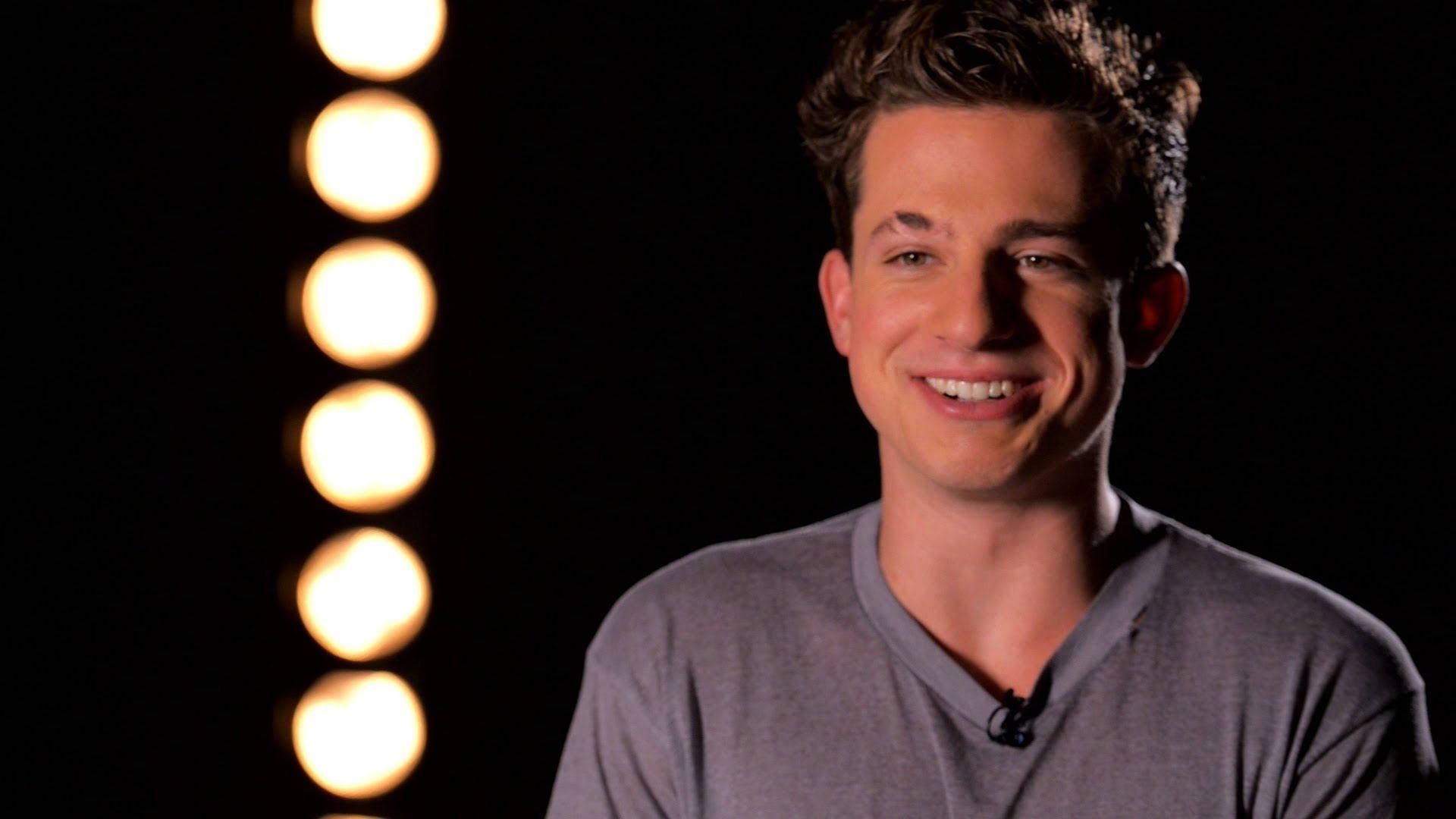 Charlie Puth, warm glowing studio lights, gray shirt, Full HD Desktop Wallpaper