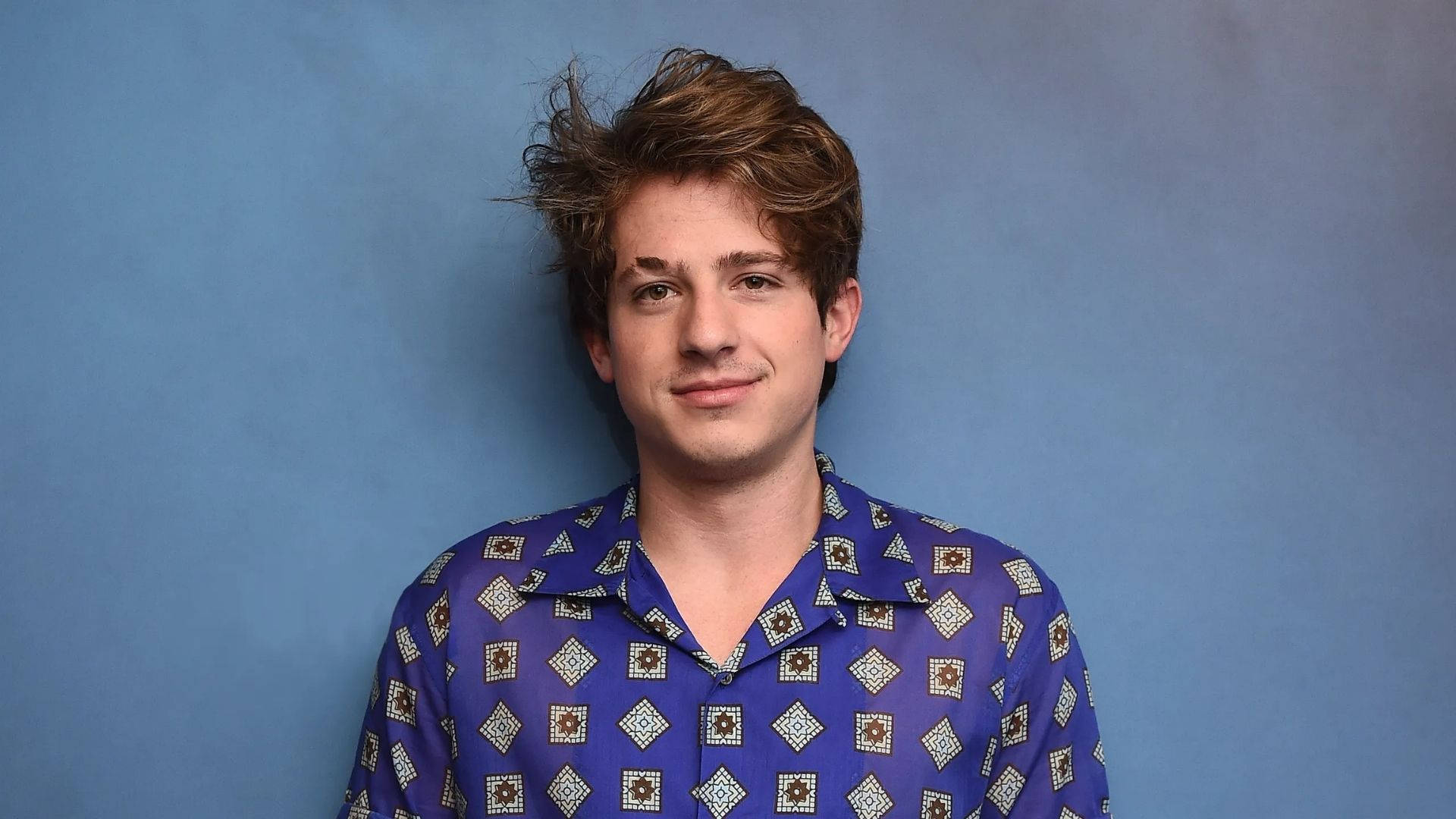 Charlie Puth, blue patterned shirt, solid blue studio backdrop, Full HD Desktop Wallpaper