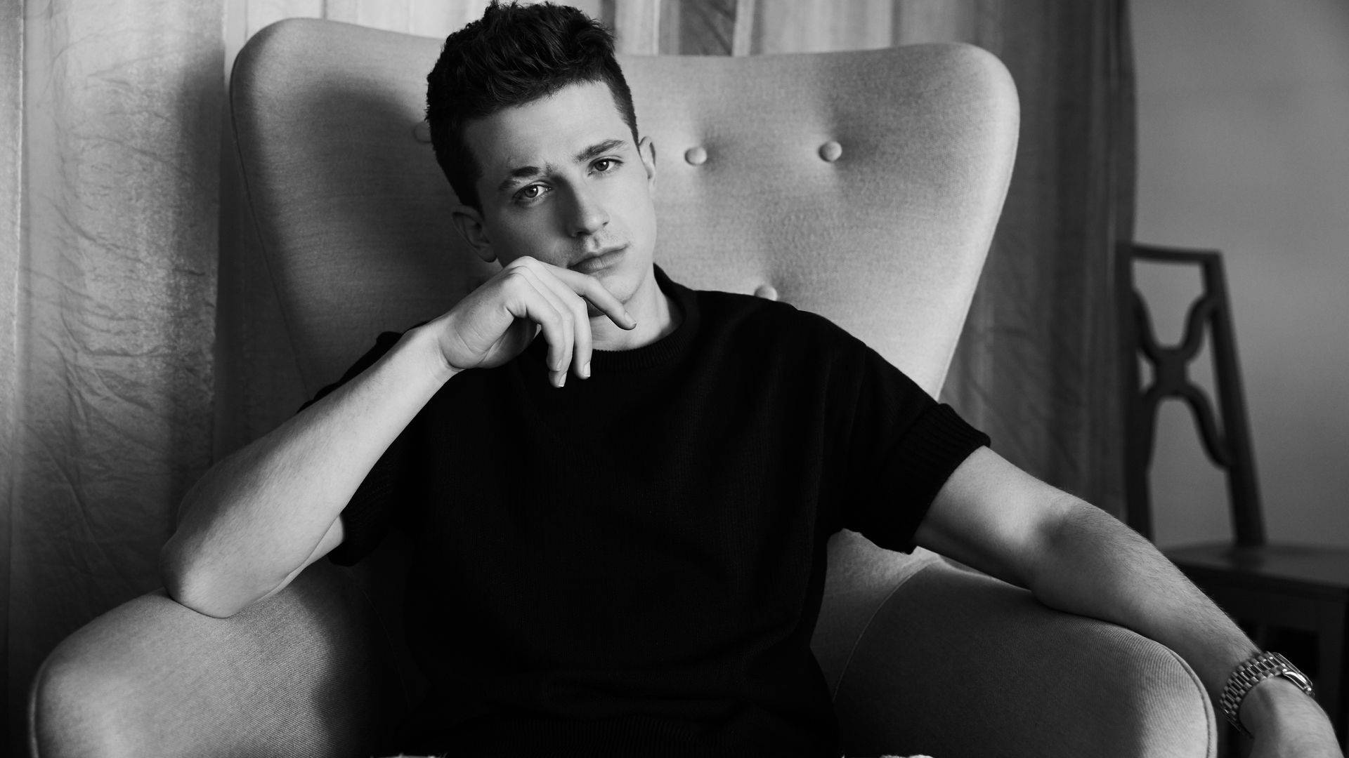Charlie Puth, black shirt, tufted armchair, Full HD Desktop Wallpaper