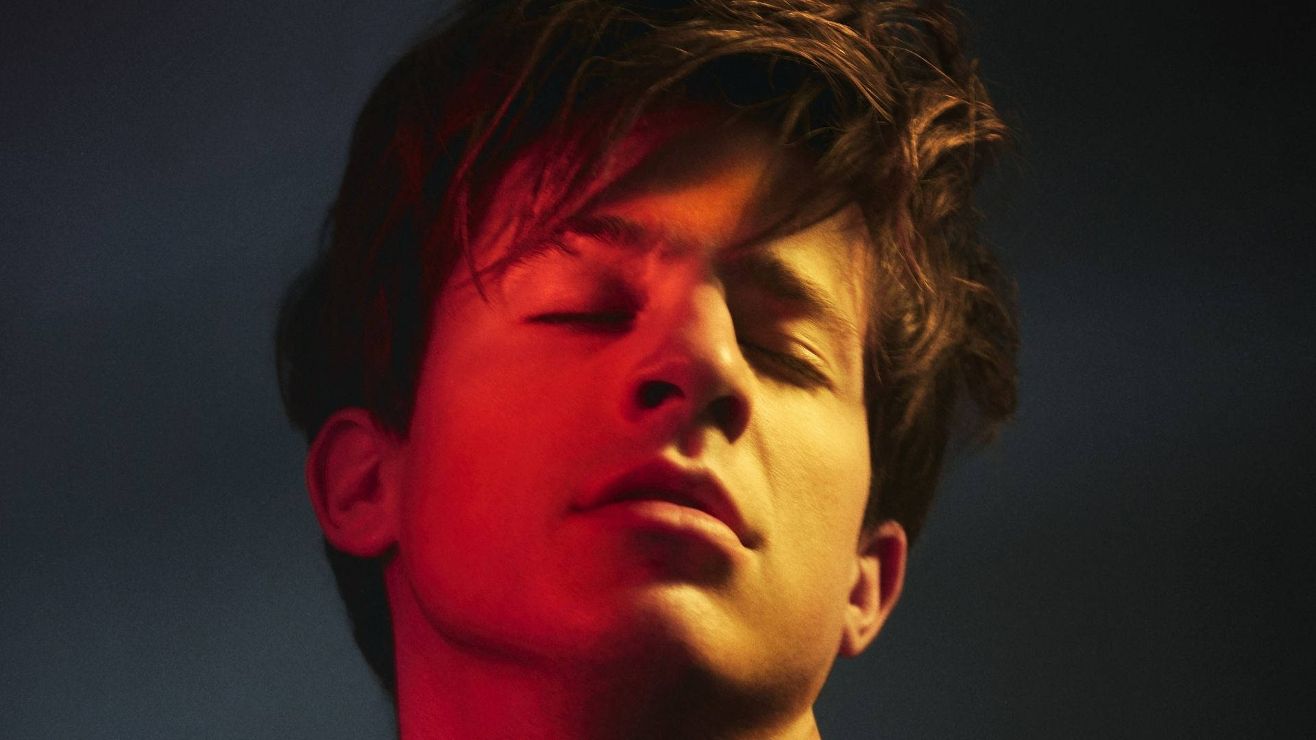 Charlie Puth, warm red light, dark blue background, Full HD Desktop Wallpaper