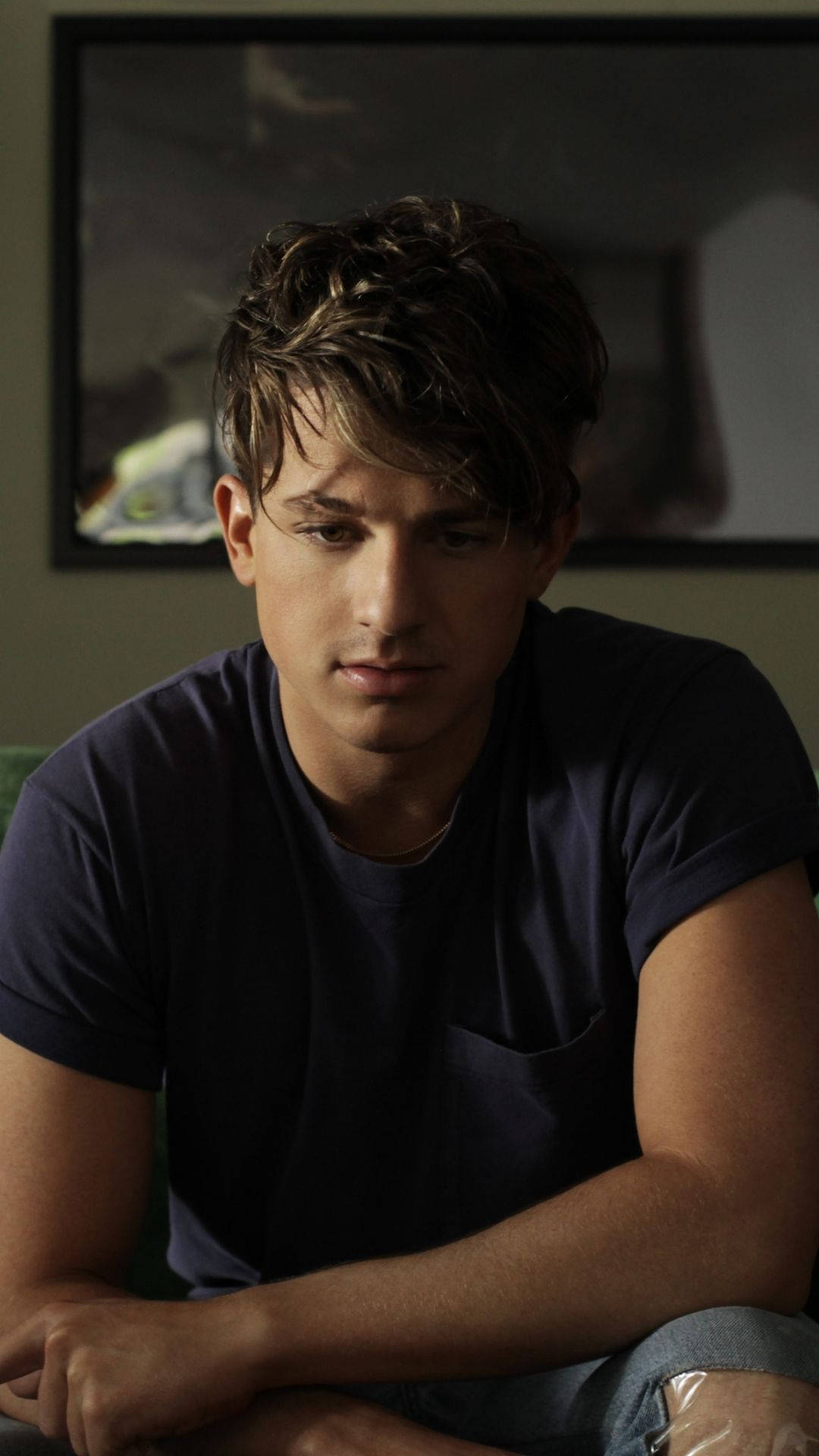 Charlie Puth, tousled brown hair, dimly lit room, Full HD Phone Wallpaper