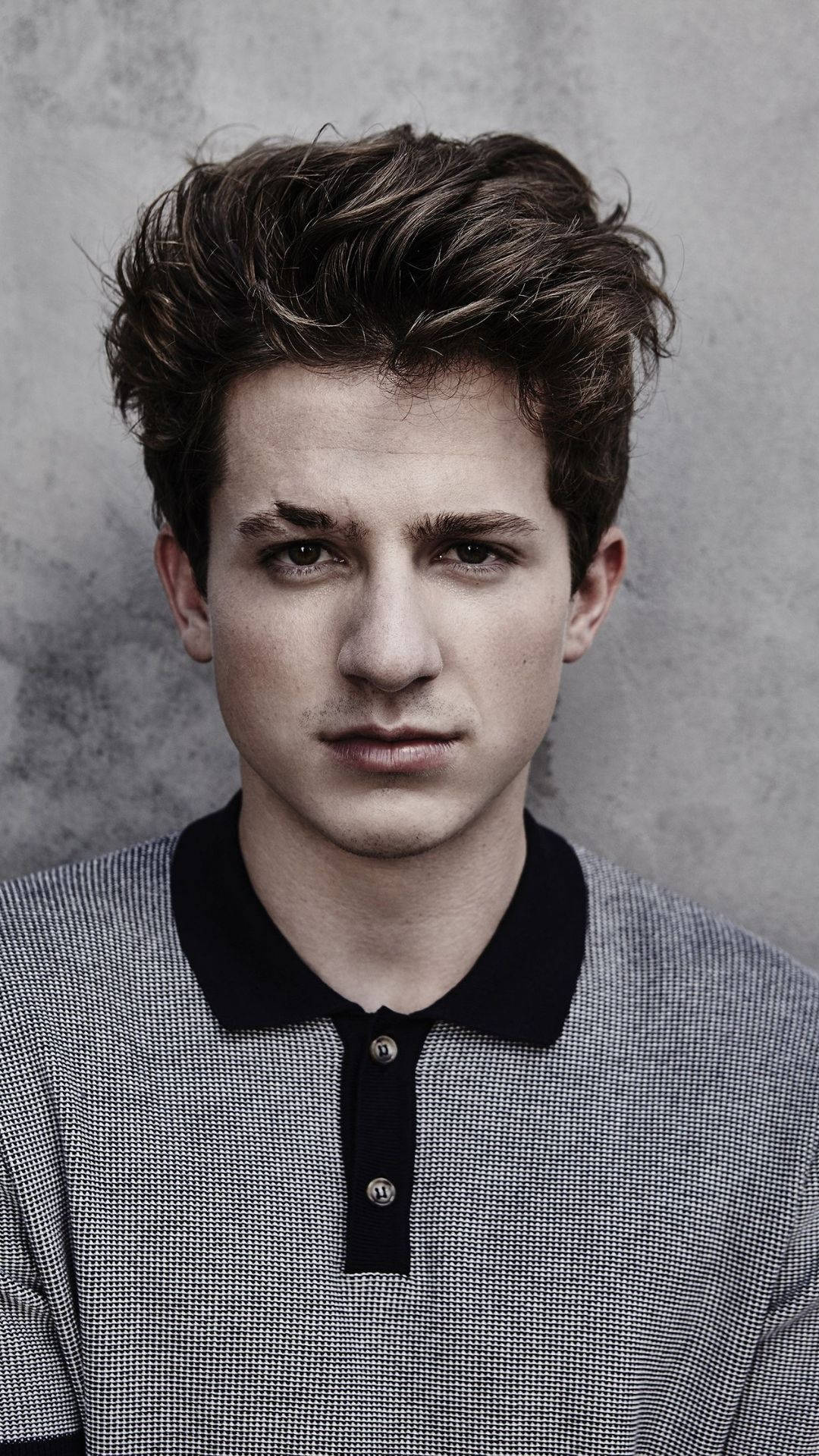 Charlie Puth, tousled brown hair, textured gray wall, Full HD Phone Wallpaper