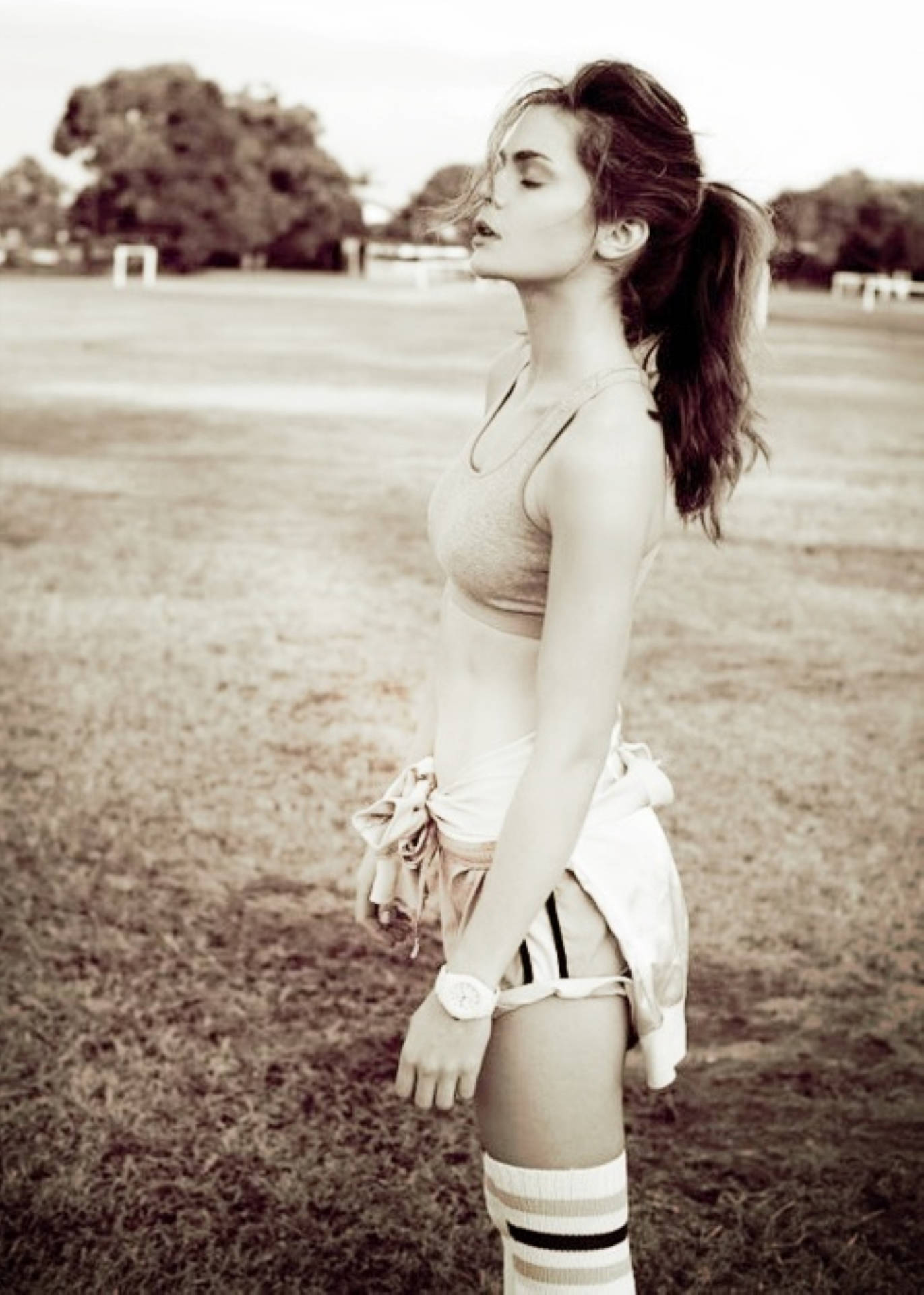 Charlotte Riley, ponytail, grassy field, Full HD Phone Wallpaper