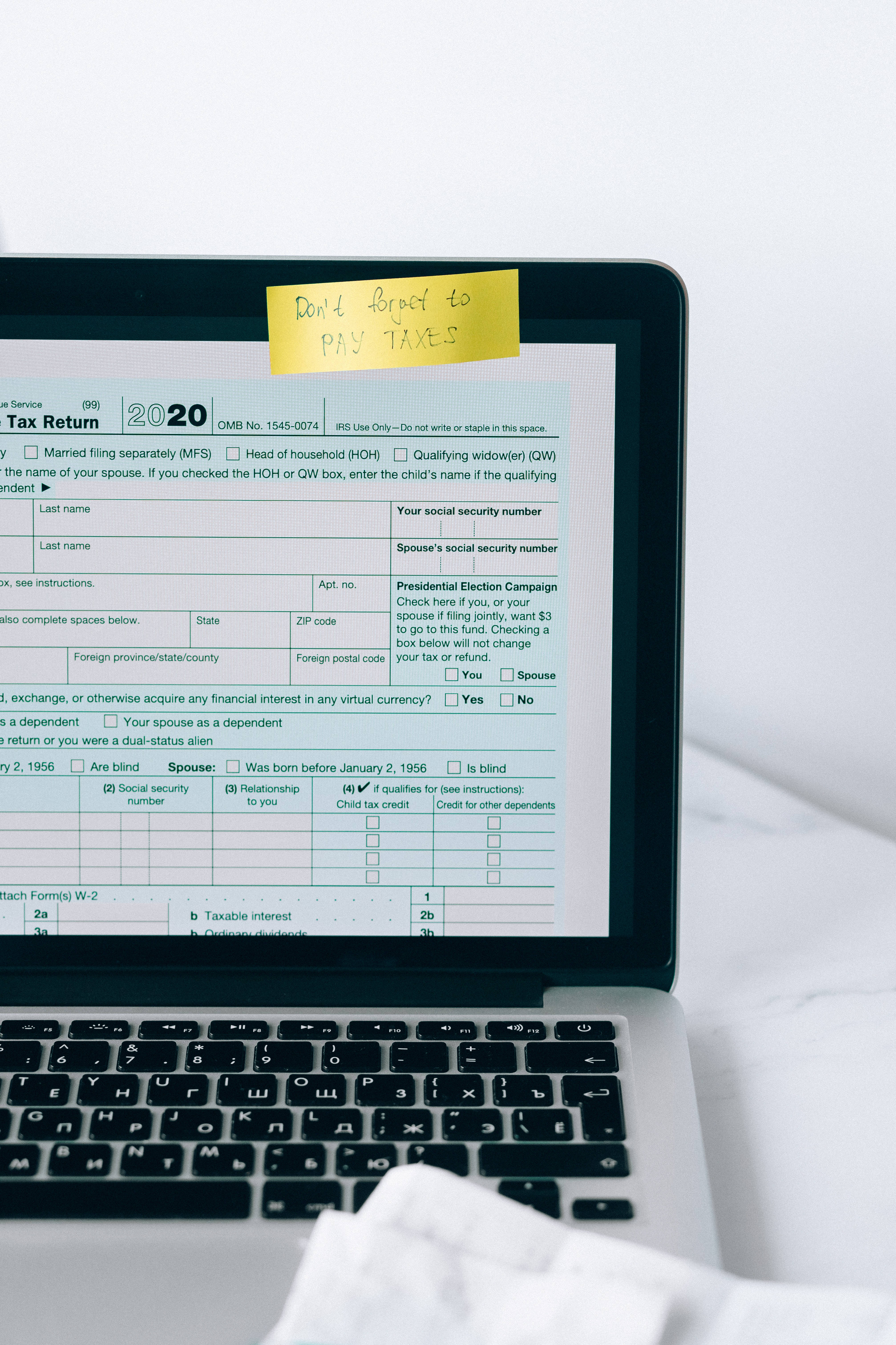 2020 IRS tax form, yellow sticky note, laptop, 5K Phone Wallpaper