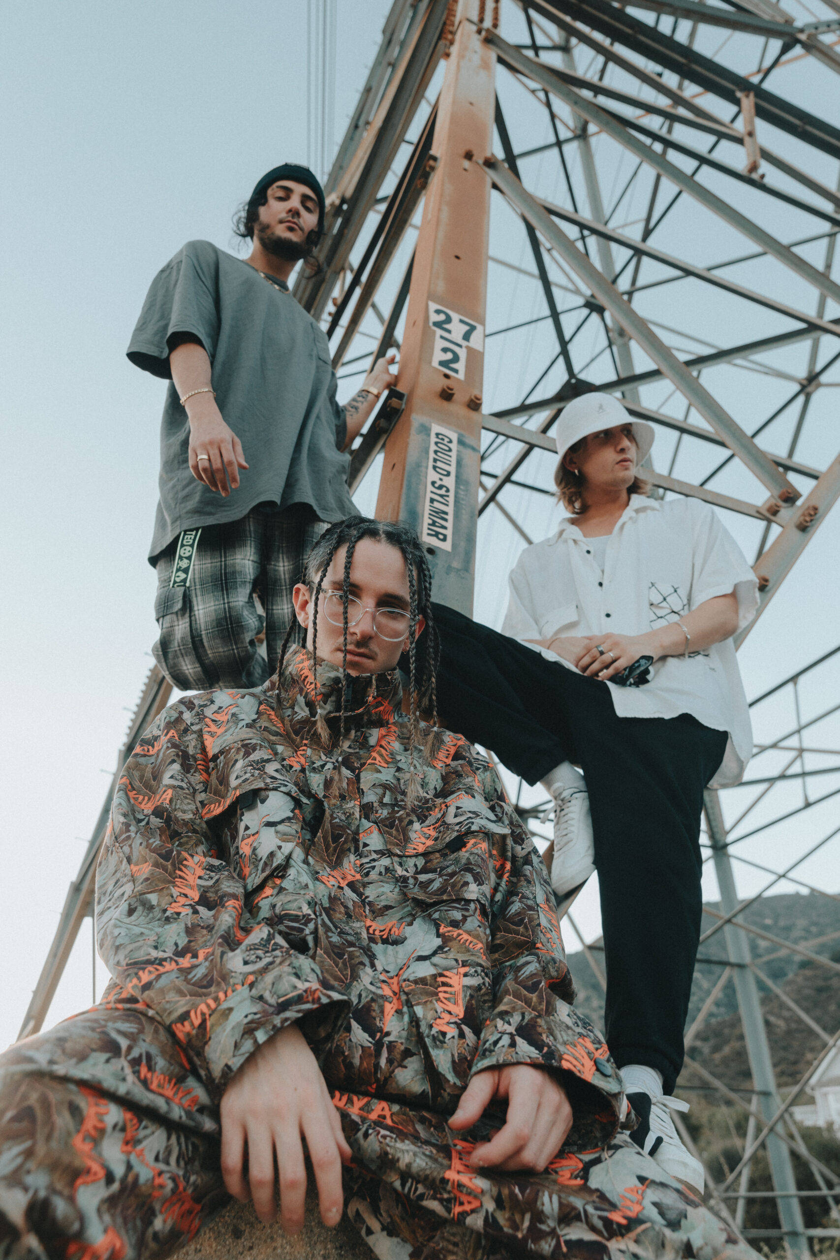 Chase Atlantic, rusted metal tower, pale sky, 2K Phone Wallpaper