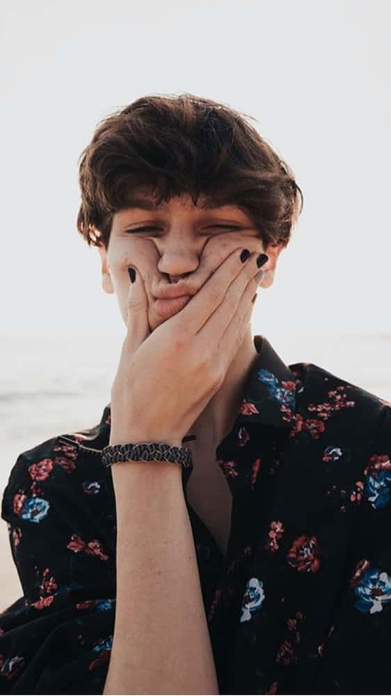 Chase Hudson, dark nail polish, bright beach backdrop, SD Phone Wallpaper