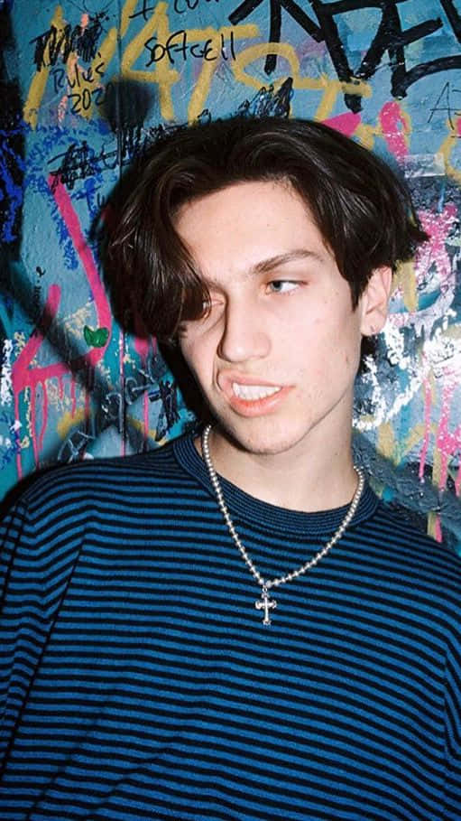 Chase Hudson, graffiti-covered wall, dark hair, SD Phone Wallpaper