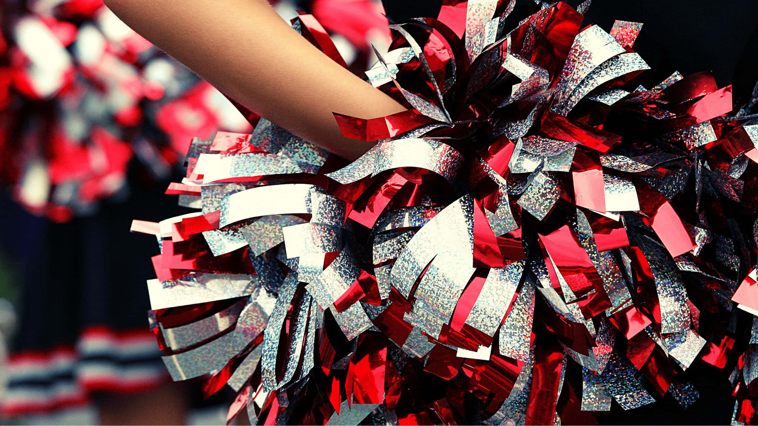 cheerleading pom poms, shiny red and silver, cheerleader's hand, 2K Desktop Wallpaper