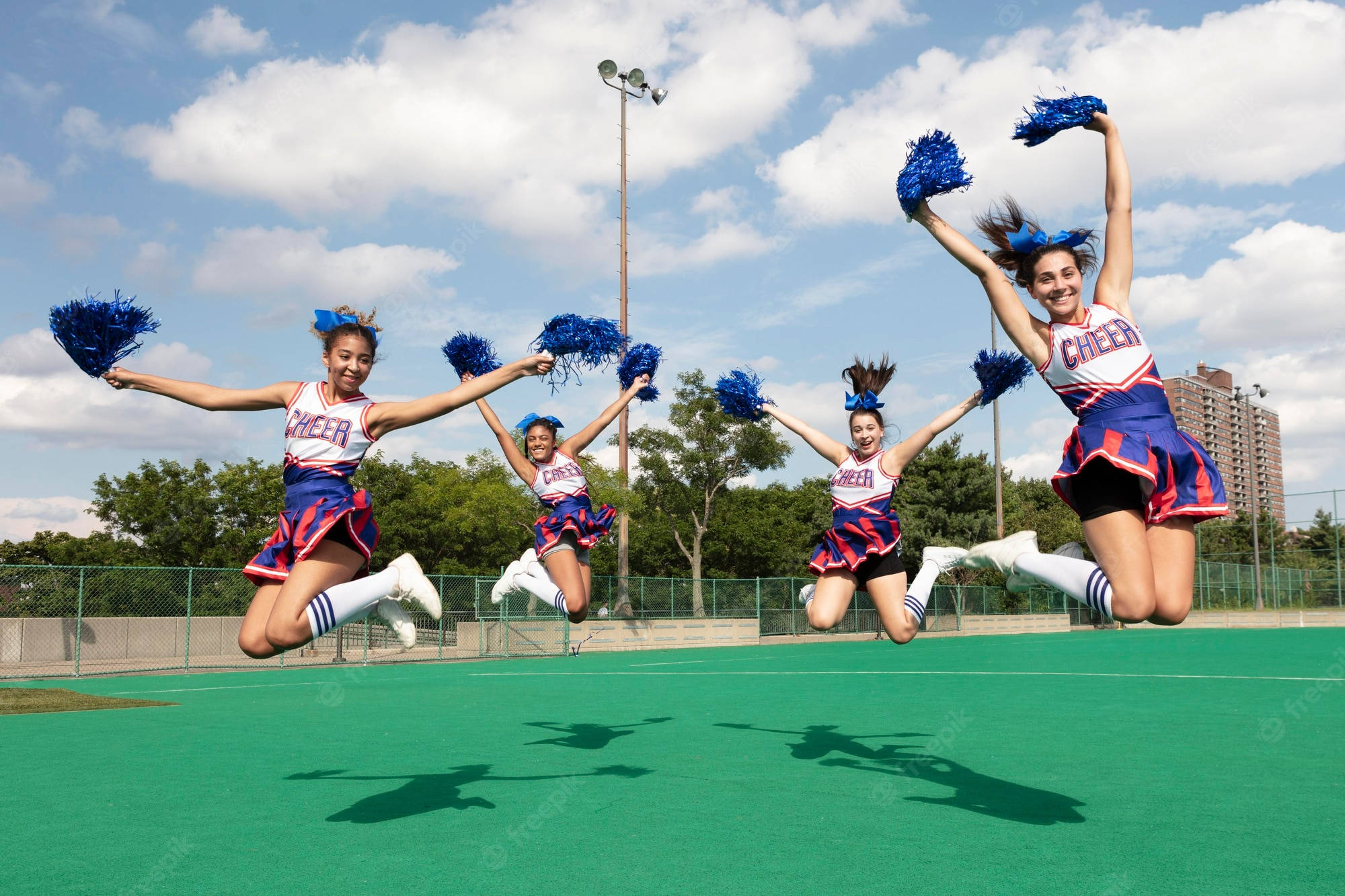 knee jump cheerleading, blue red and white uniforms, pom-poms, Full HD Desktop Wallpaper