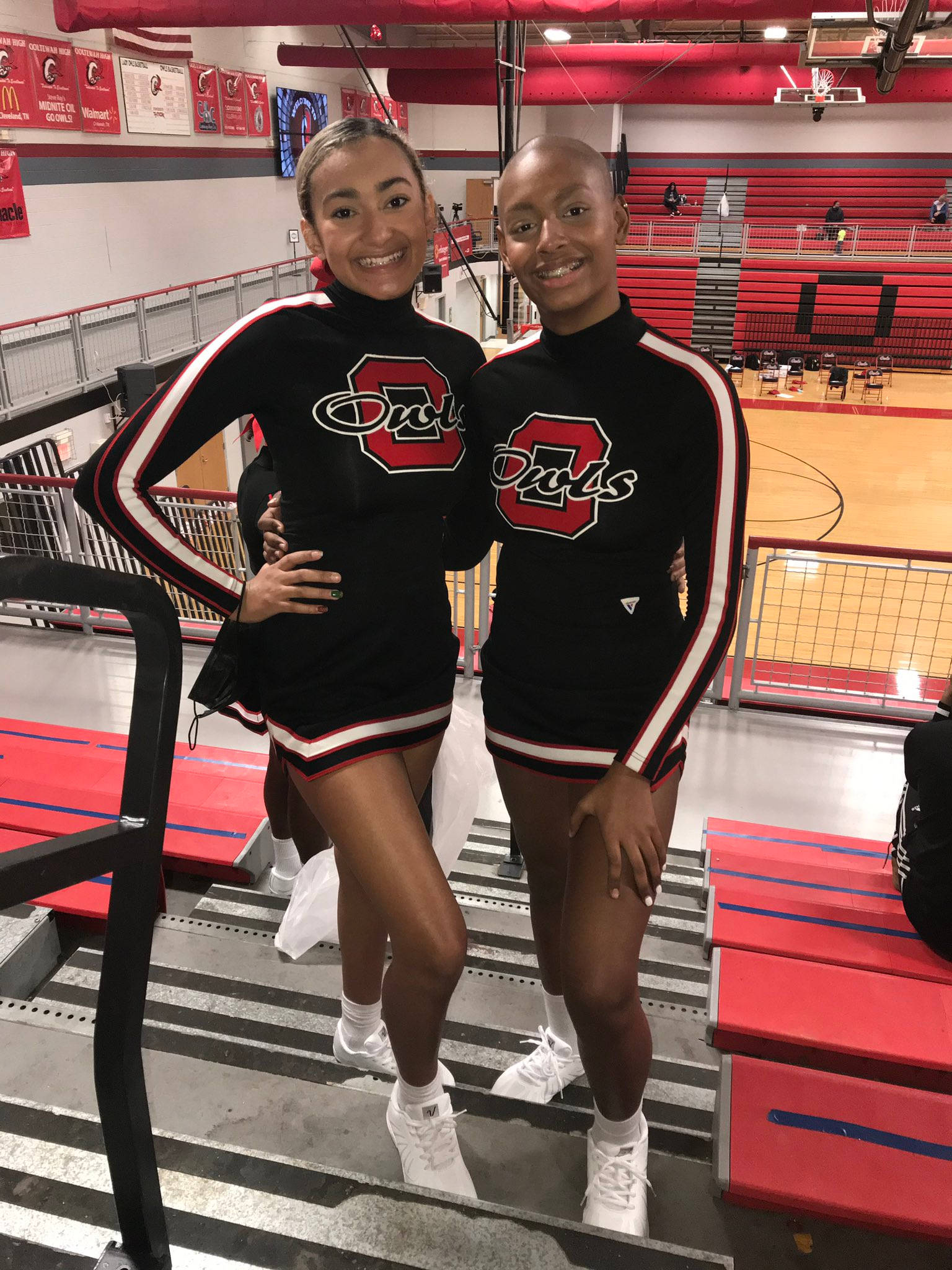 cheerleaders, black and red uniforms, bleachers, Full HD Phone Wallpaper