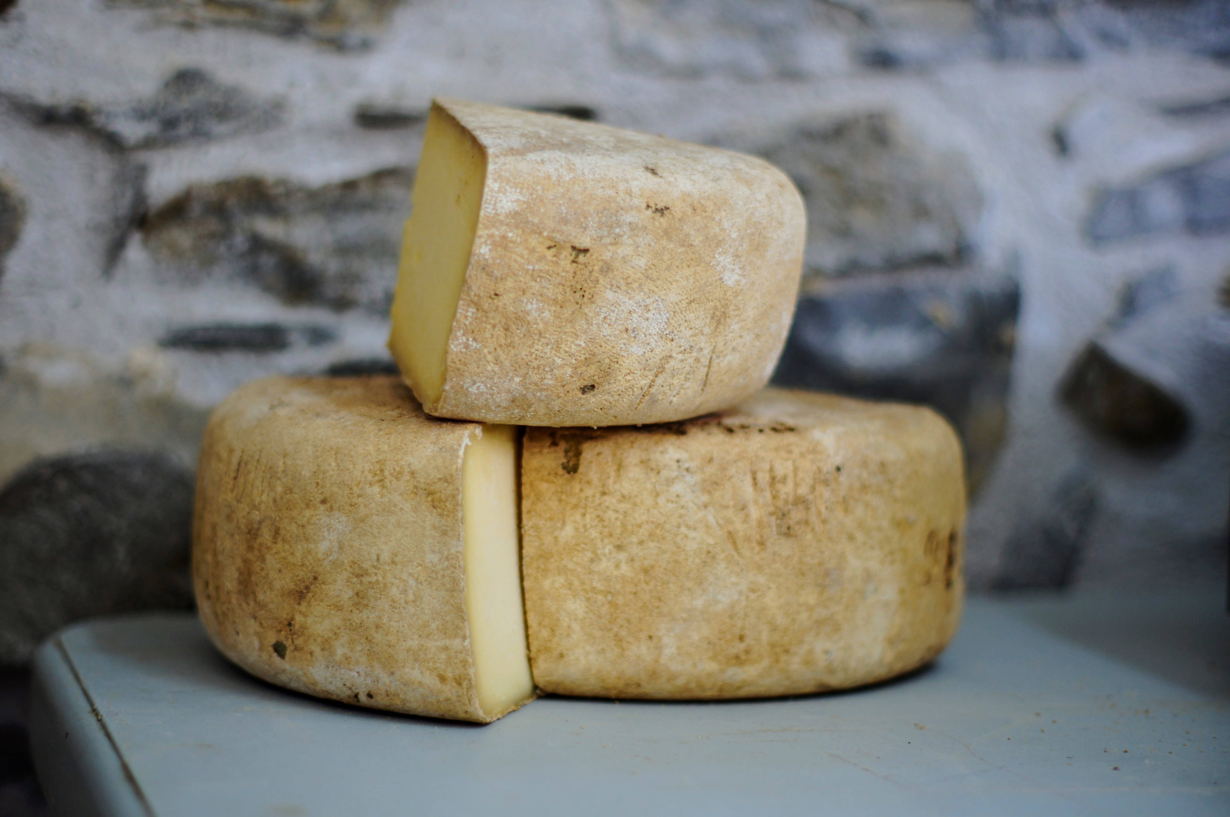 sliced cheese truckles, rustic wheels of cheese, wedge cut, 4K Desktop Wallpaper